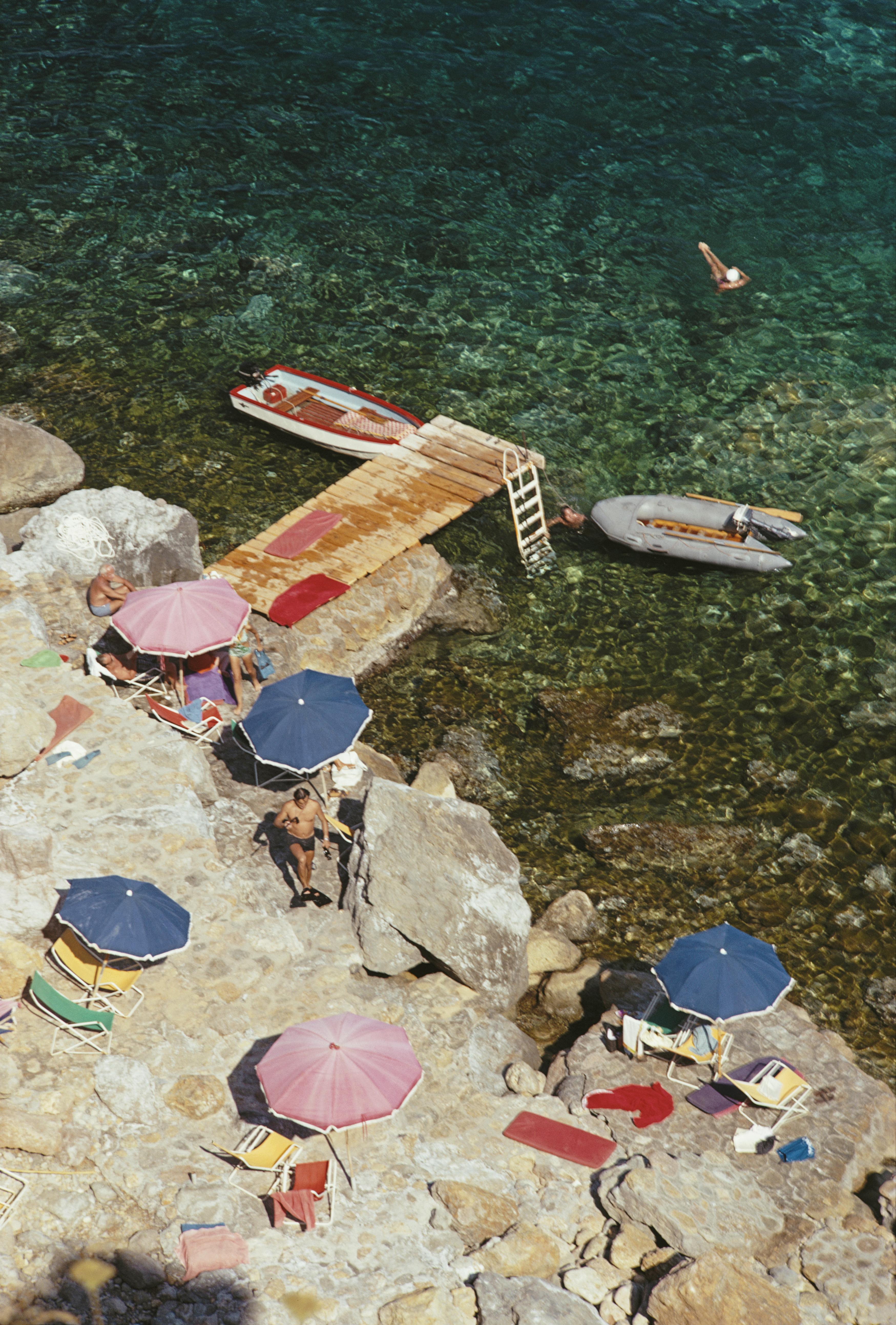 'Tuscan Holiday' 1969 Slim Aarons Limited Estate Edition Print 

Holidaymakers on the Tuscan coast at the Hotel Il Pellicano at Porto Ercole, August 1969. 
(Photo by Slim Aarons/Hulton Archive/Getty Images)

Produced from the original