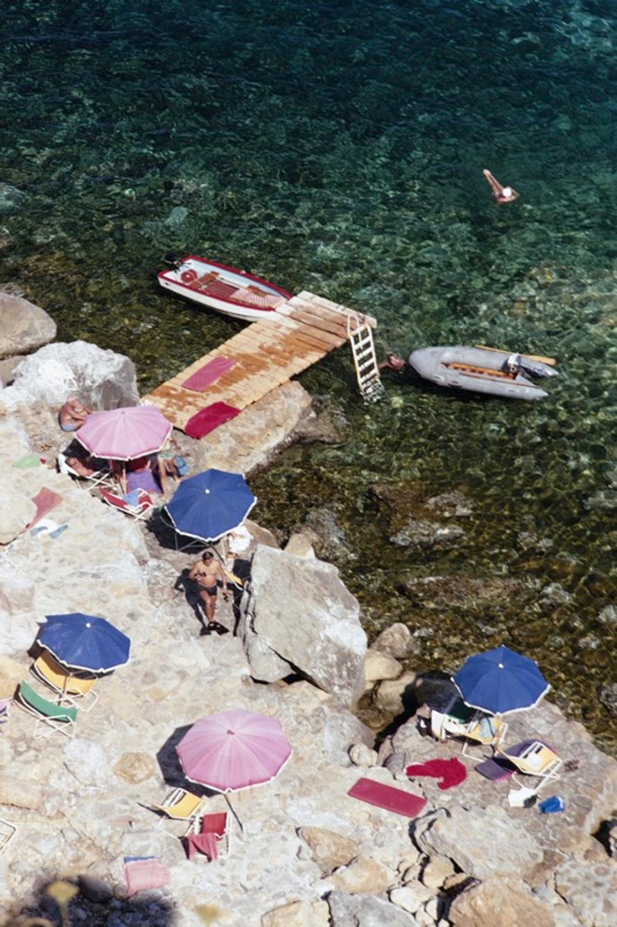Tuscan Holiday 
1969
by Slim Aarons

Slim Aarons Limited Estate Edition

Holidaymakers on the Tuscan coast at the Hotel Il Pellicano at Porto Ercole, August 1969.

unframed
c type print
printed 2023
20 × 16 inches - paper size


Limited to 150