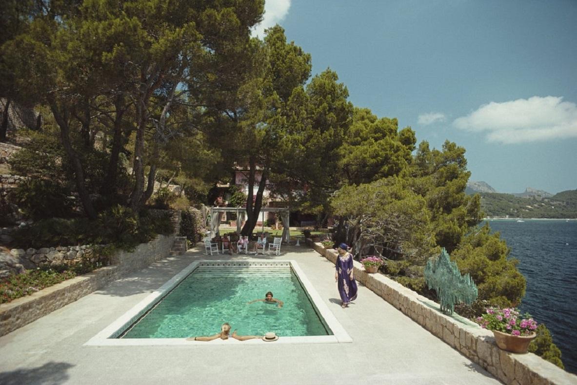 'Vane's Villa' 1987 Slim Aarons Limited Estate Edition Print 

Guests at Vane Ivanovic's villa in Cap de Formentor, Majorca, Spain, 1987. 

Produced from the original transparency
Certificate of authenticity supplied 
Archive stamped

Paper Size 