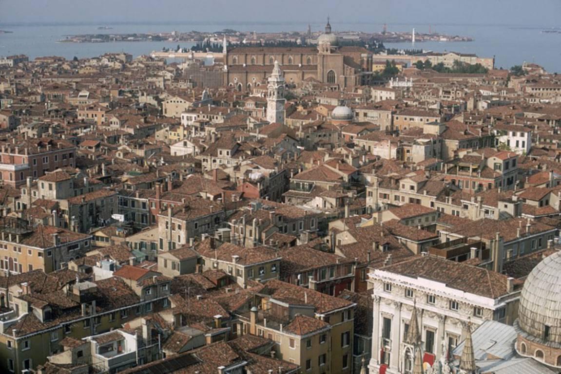 View over Venice, Italy, 1973
Chromogenic Lambda print
Estate stamped and hand numbered edition of 150 with certificate of authenticity from the estate.   

A view over the rooftops of Venice from the top of St Mark's Basilica towards the islands of