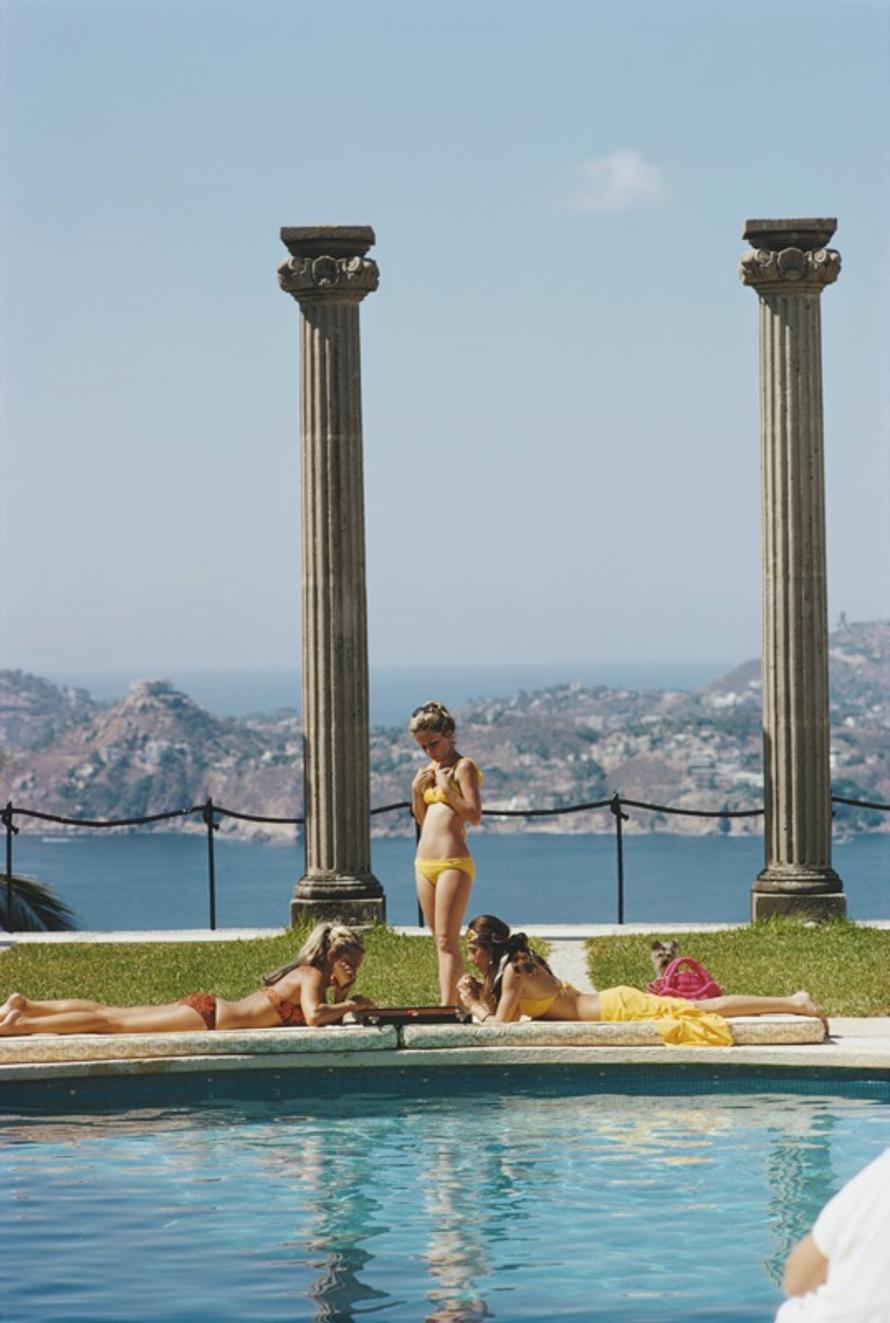 Villa Nirvana 
1972
by Slim Aarons

Slim Aarons Limited Estate Edition

Guests at the Villa Nirvana, owned by Oscar Obregon, in Las Brisas, Acapulco, Mexico, February 1972.

unframed
c type print
printed 2023
20 × 16 inches - paper size


Limited to