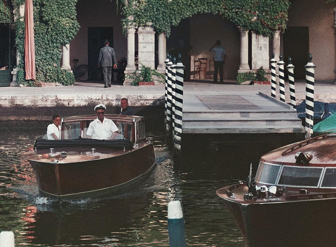 Westin Excelsior, Lido in Venice, 1957 - Venetian Gondolas in Canals in Italy - Black Color Photograph by Slim Aarons
