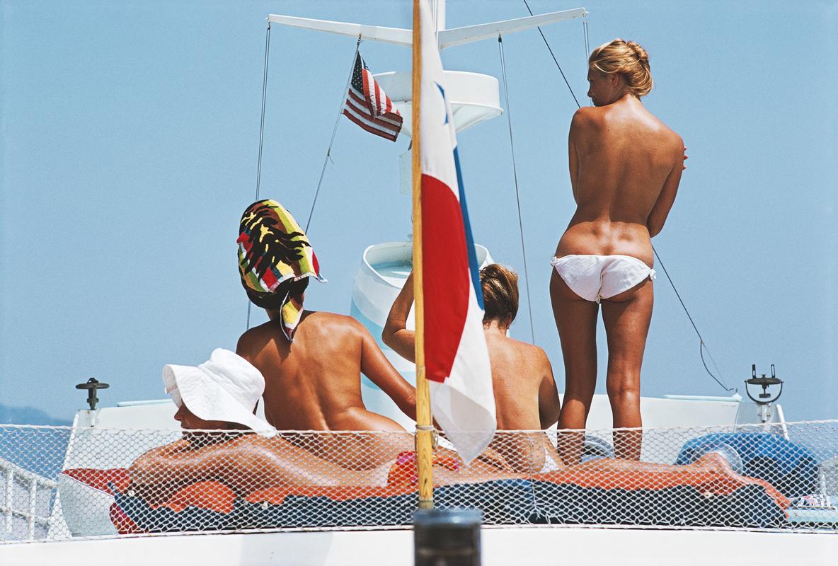 'Yacht Holiday' 

Tanned bodies on the deck of Dino Pecci Blunt's yacht in Marbella, 1967. 

Paper Size  24x20 inches / 60 x 50 cm 
 
Estate Stamped Collection Edition to 150 

Photo by Slim Aarons

Printed in 2025

Limited to 150 prints only