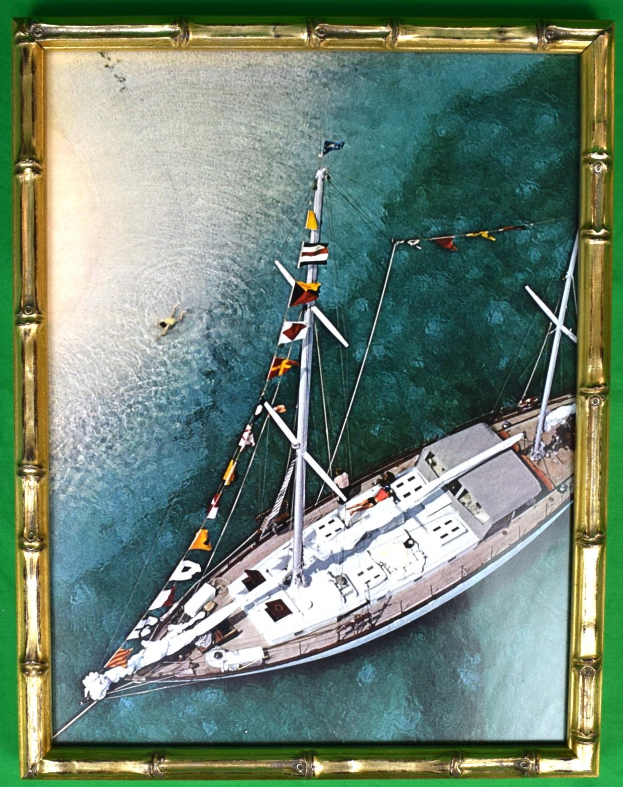 Art Sz: 13"H x 9 7/8"W

Frame Sz: 14 1/4"H x 11"W

In custom gilt bamboo frame

Original color page from Slim Aarons' iconic book "A Wonderful Time" published 1974

Sixty-eight foot charter ketch 'Traveler II at anchor in the lee of Stocking Island,