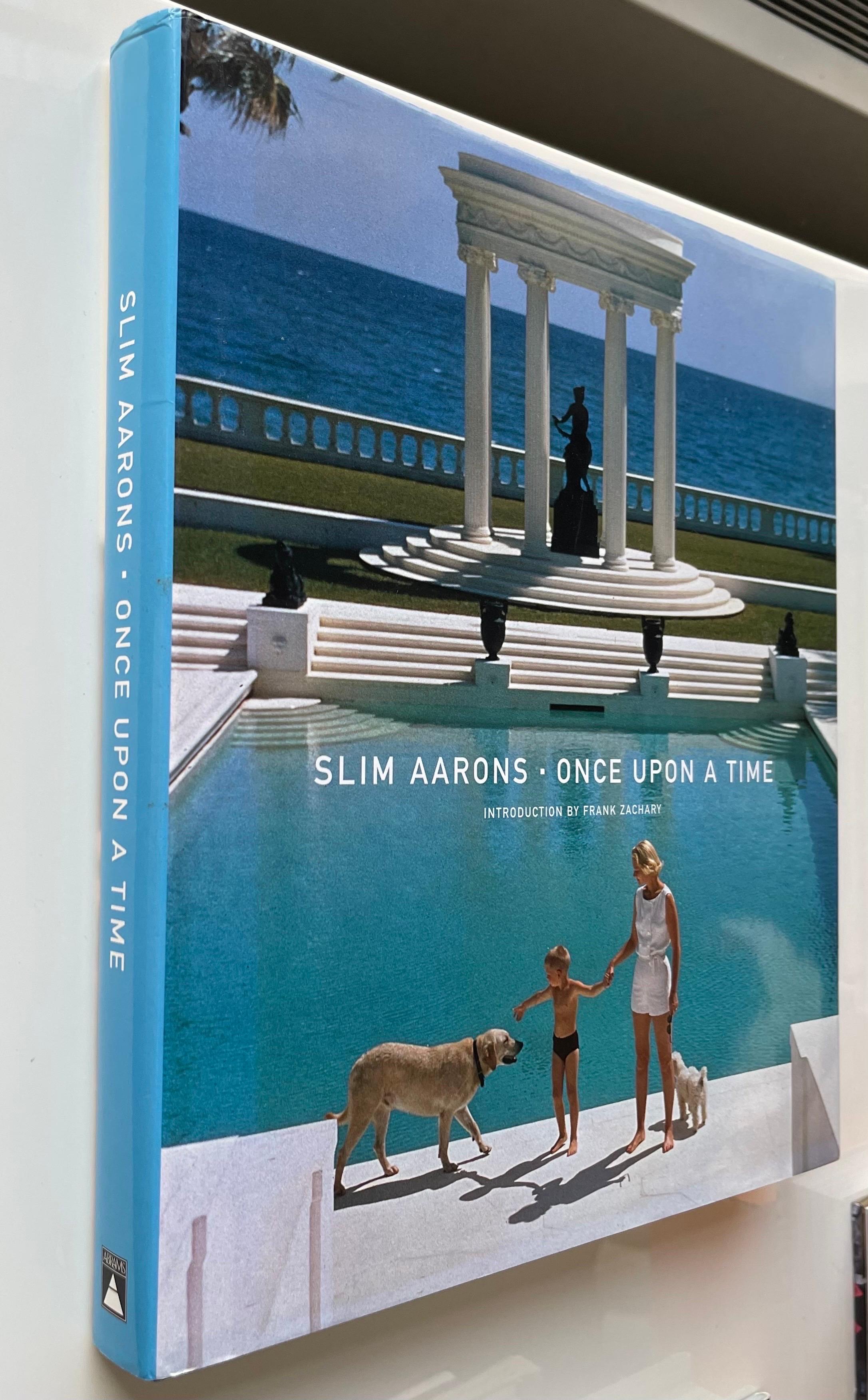 Slim Aarons: Once Upon A Time. Abrams 1st edition hardcover, 2003. 240 pages. Featuring many of Slim Aarons iconic photographs. 
