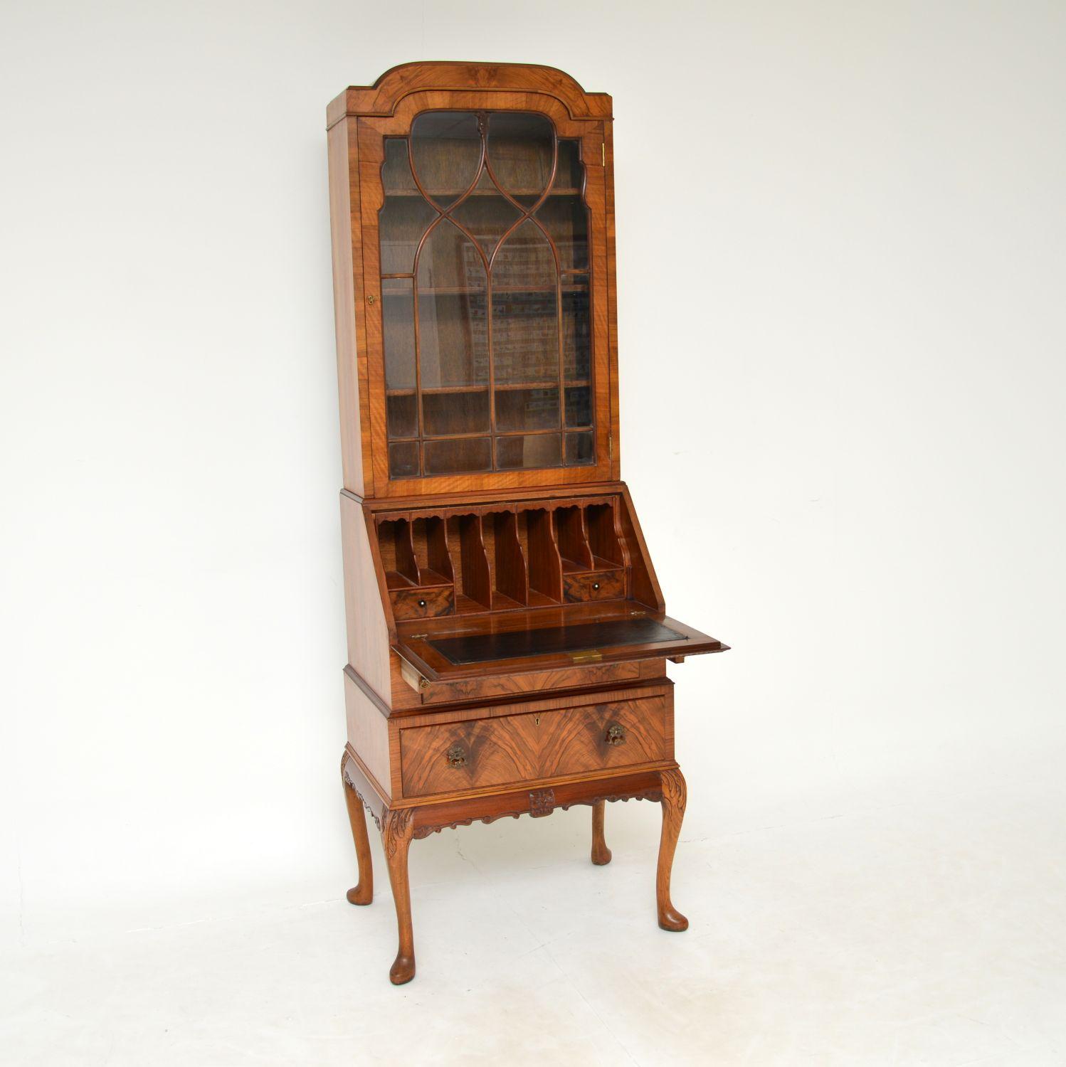 A stunning antique bureau bookcase of slim proportions in book matched figured walnut. This was made in England & dates from around the 1900-1910 period.
It is of superb quality and is a very useful size. It takes up very little floor space, yet