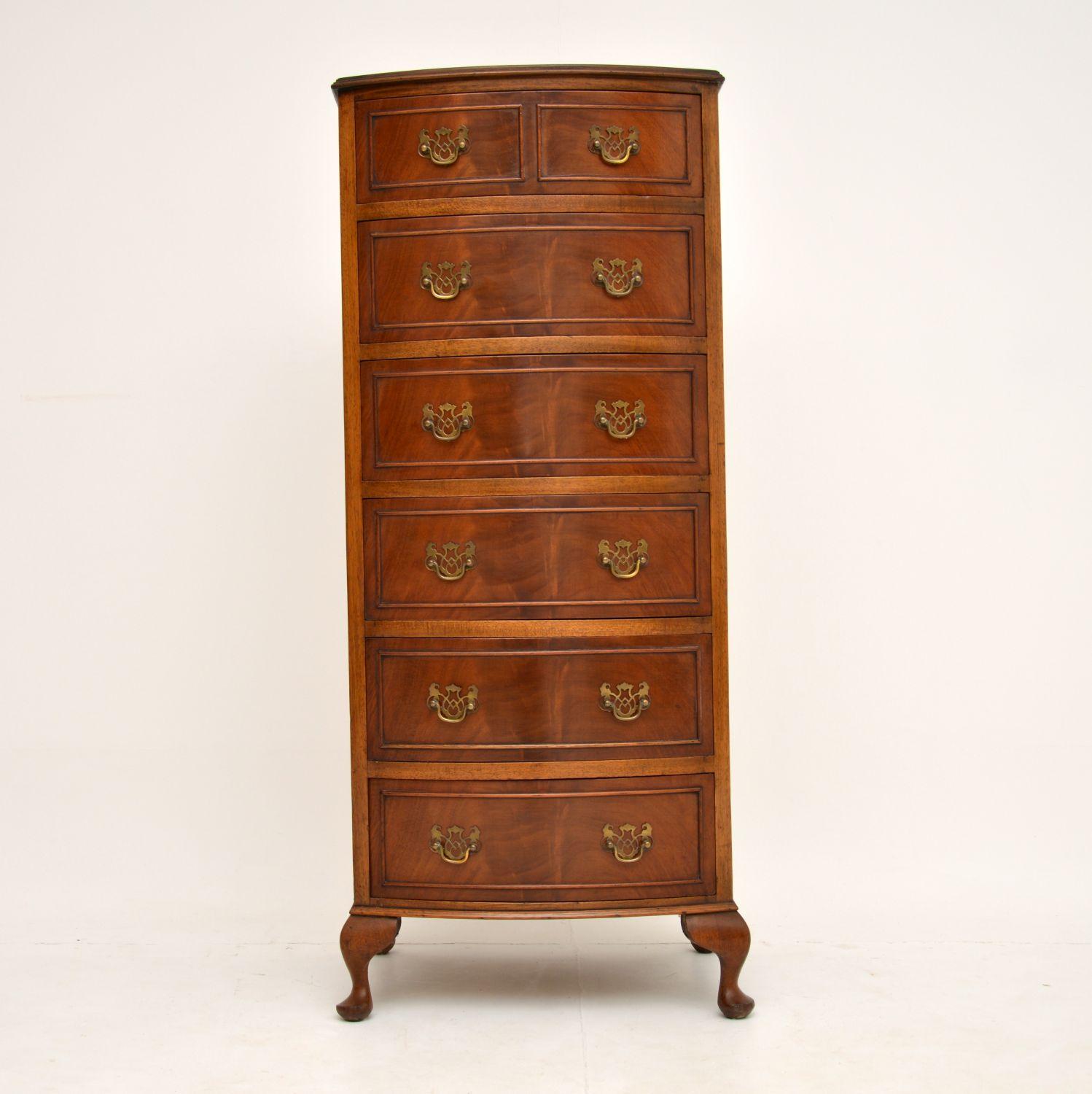 A beautiful slim bow front mahogany chest of drawers. This is in the antique Georgian style & I believe it dates from circa 1930s period.

It is a very useful size, offering lots of storage space while not taking up much floor space. The quality