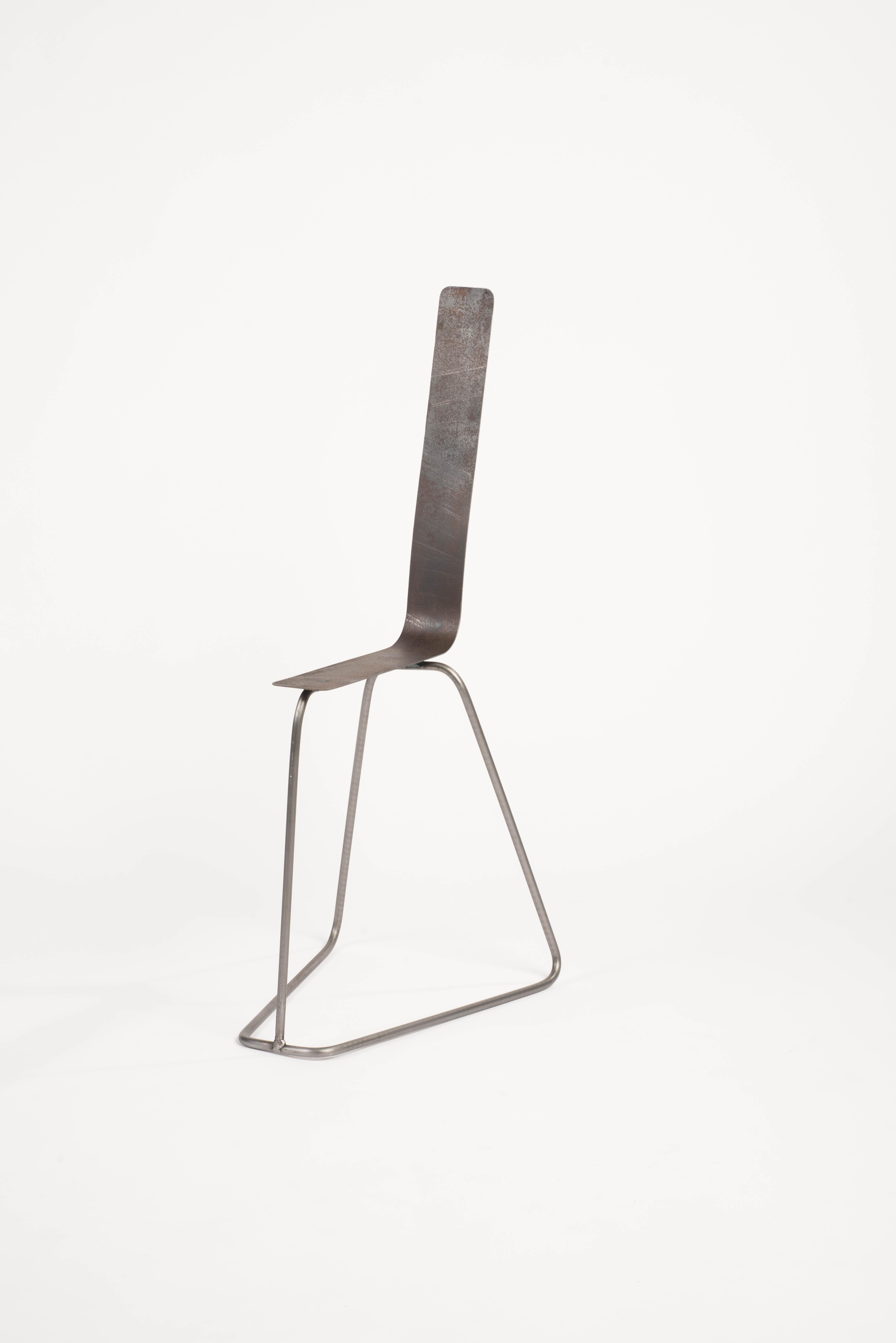 Slim chair by Neil Nenner
Punctuation marks
Dimensions: H 90 x L 48 x W 40 cm
Materials: Steel tubes and rods with a natural finish
 Corten sheets 
 
Neil Nenner (b.1977, Kibbutz Mevo Hama), Independent designer / Artist and lecture in