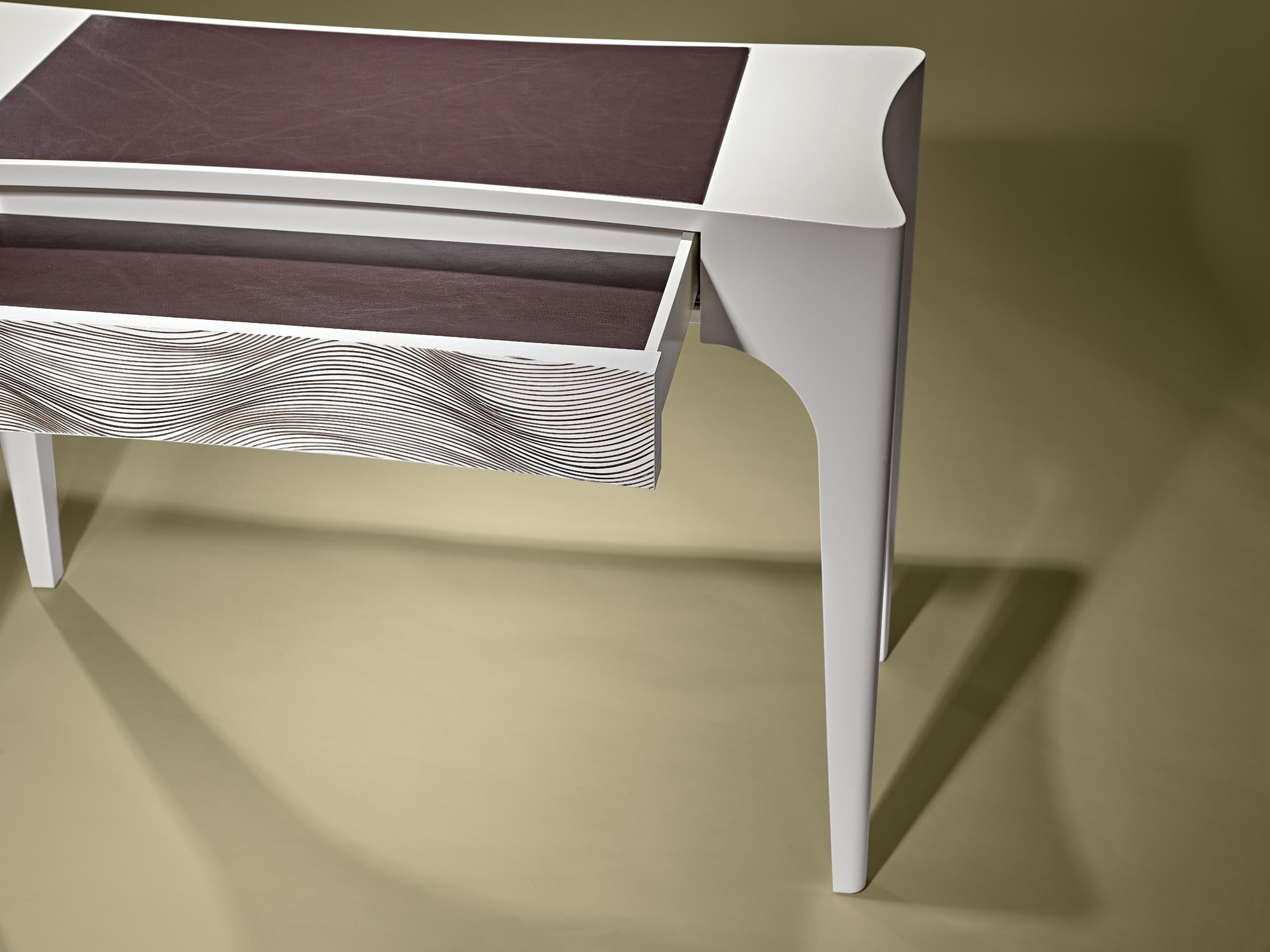 Desk in matt ivory lacquer, leather inserted top and drawer with artistic intervention of Paulo Neves.

Bespoke / Customizable
Identical shapes with different sizes and finishings.
All RAL colors available. (Mate / Half Gloss / Gloss)