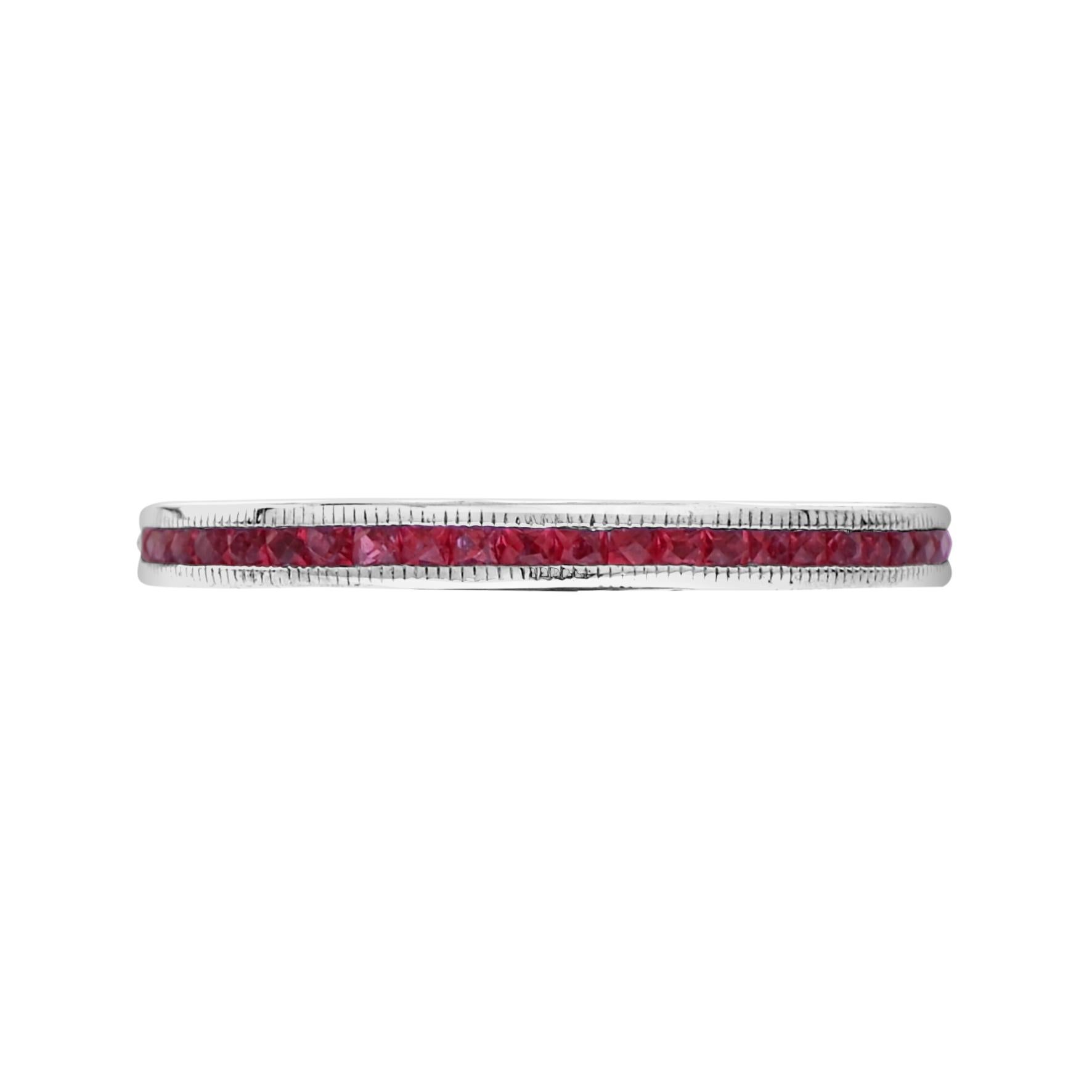 Discover a beautiful and dainty piece of art deco history. The natural French cut rubies run around the entire ring in an enclosed type of setting. This piece is great for wearing with an antique or vintage engagement ring or stacking with multiple