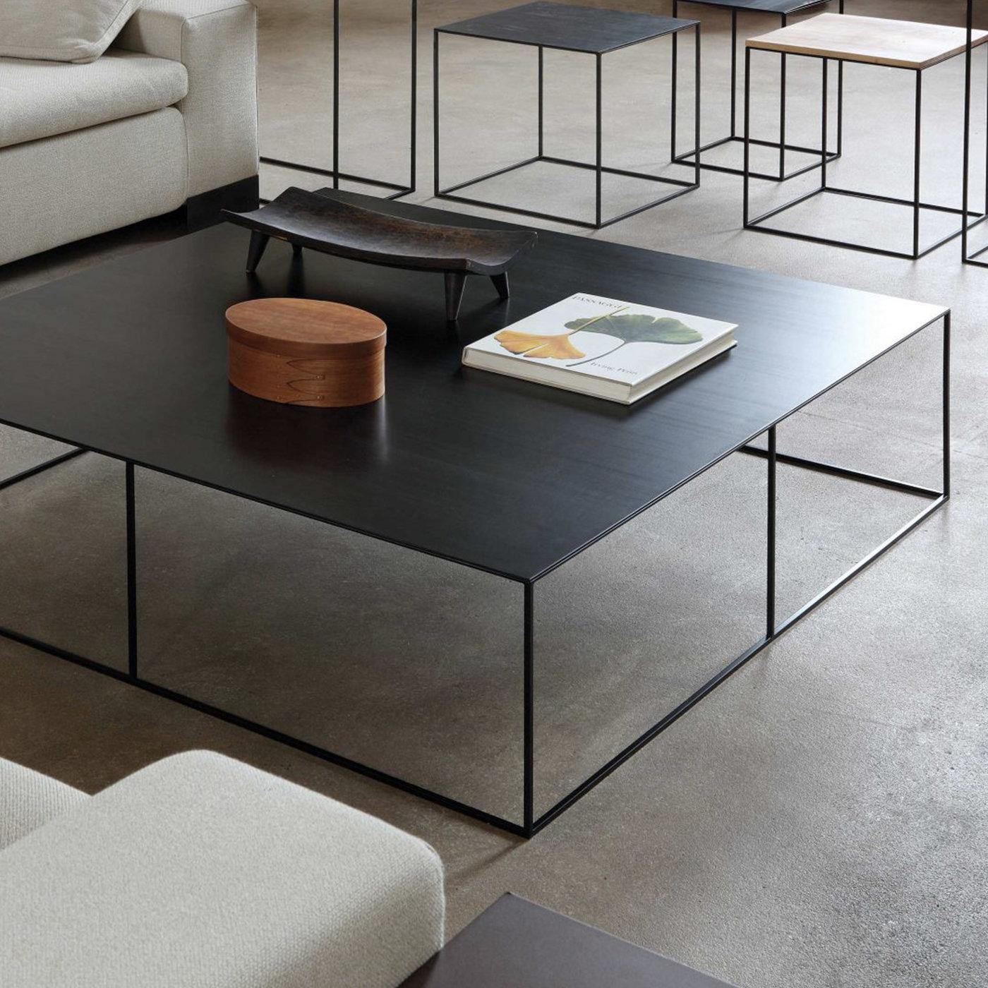 This exquisite coffee table will make a statement in a black and white or neutral-colored decor, particularly if contemporary or Industrial, and will also complement other black furniture pieces by the same designer for a cohesive look. The
