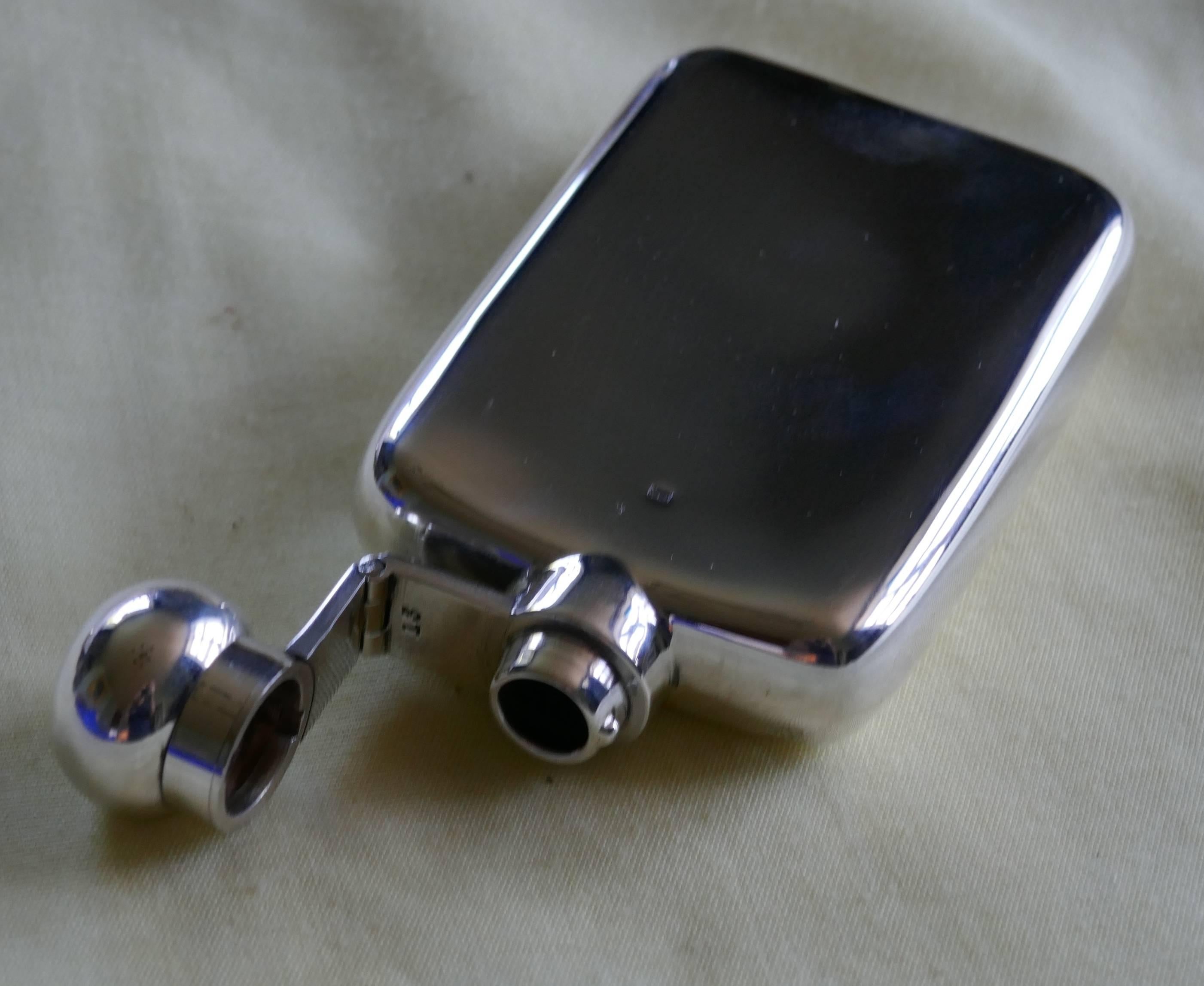 Slim silver hallmarked hip flask, Robert Pringle & Sons

A lovely piece the flask has a rounded shape with no sharp corners, making it ideal to keep in either a breast, hip pocket or handbag, the lid is hinged with a screw grip.

The flask is in