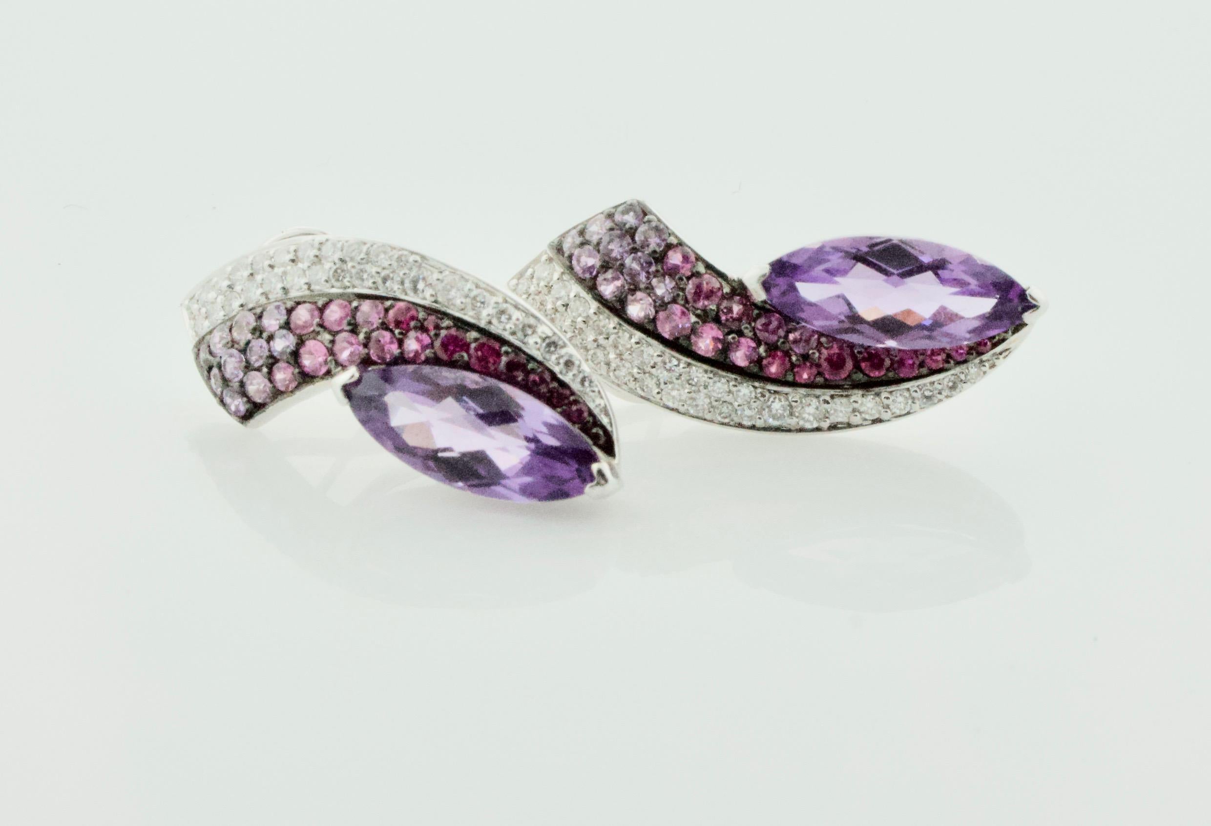 Slimming Amethyst Pink Sapphire and Diamond Earrings in 18k
Two Marquise Cut Amethysts Weighing 6.00 Carats Approximately 
Fifty Six Round Cut Pink Sapphires Weighing 1.85 Carats Approximately 
Twenty Eight Round Brilliant Cut Diamonds Weighing .85