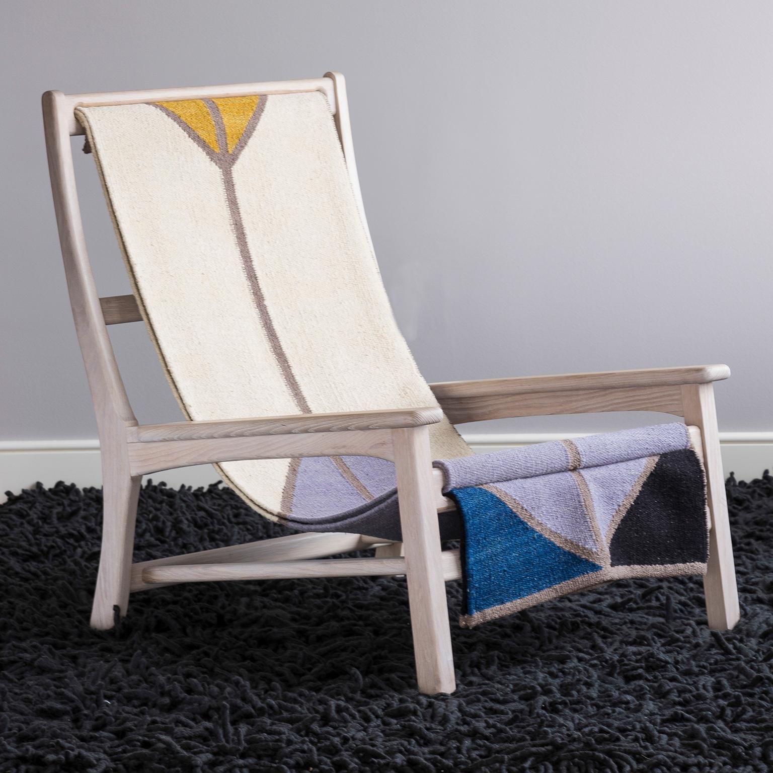 Ash lounge chair with gray stain, woven wool rug sling seat. Available in oak, and other finishes as well