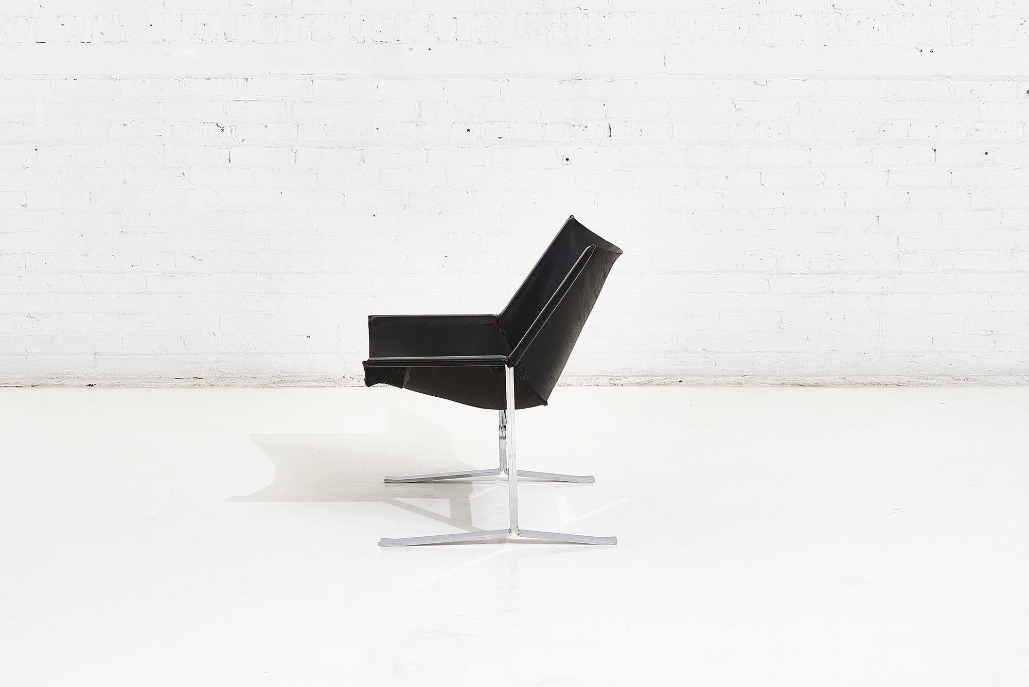 Sling chair model 248 by Clement Meadmore, circa 1970. Chrome plated steel base. Three black reinforcement panels have been added too underside to reinforce vintage leather.  Beautiful patina on leather.  Wear consistent with age and use.