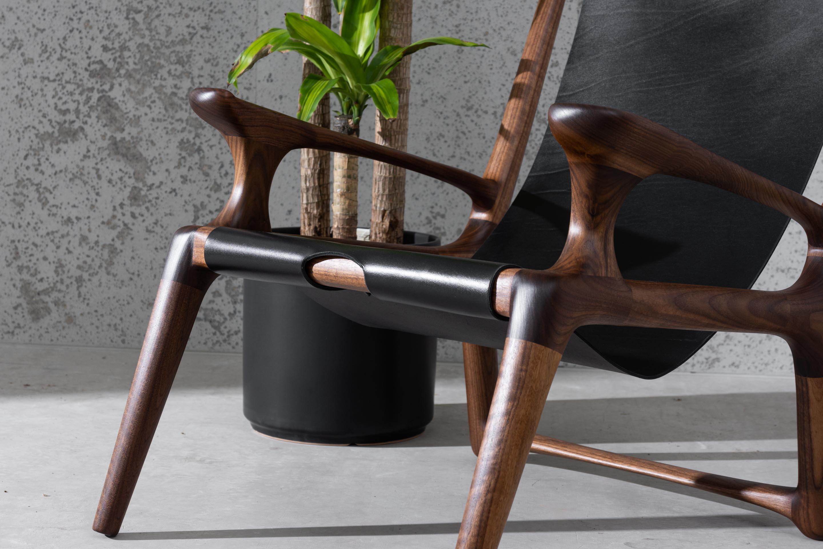 Hand-Carved Sling Chair with Leather, Arms Connected, Lounge Armchair Walnut + Black Leather For Sale