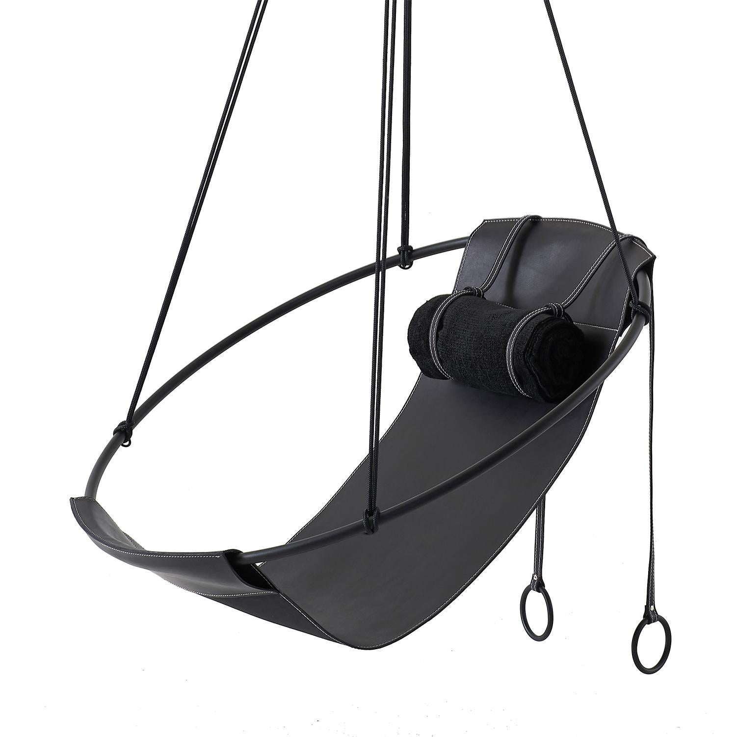 Stripped away from all excess, this hanging chair has a circular frame with the sheets of soft leather hanging loose within it, to create a sleek, sexy, and oh so comfortable experience. This chair’s clean lines and lightness makes it a perfect fit