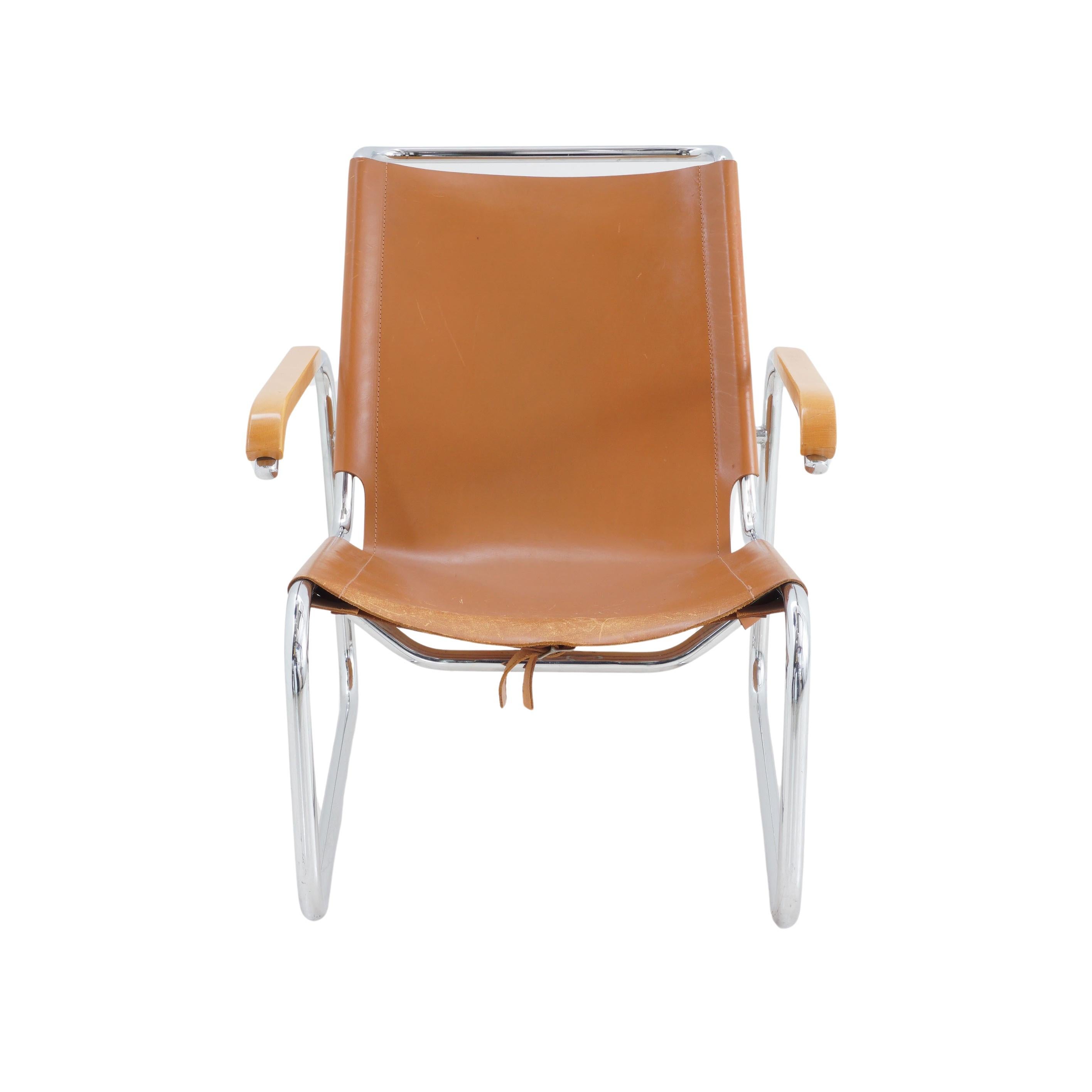 Let's talk about this Marcel Breuer Sling Lounge Chair from the 1930s, shall we? It's got thick cognac leather that's like the perfectly aged skin of a Hollywood starlet, and it reclines as you lean back, because it's polite and knows how to treat a