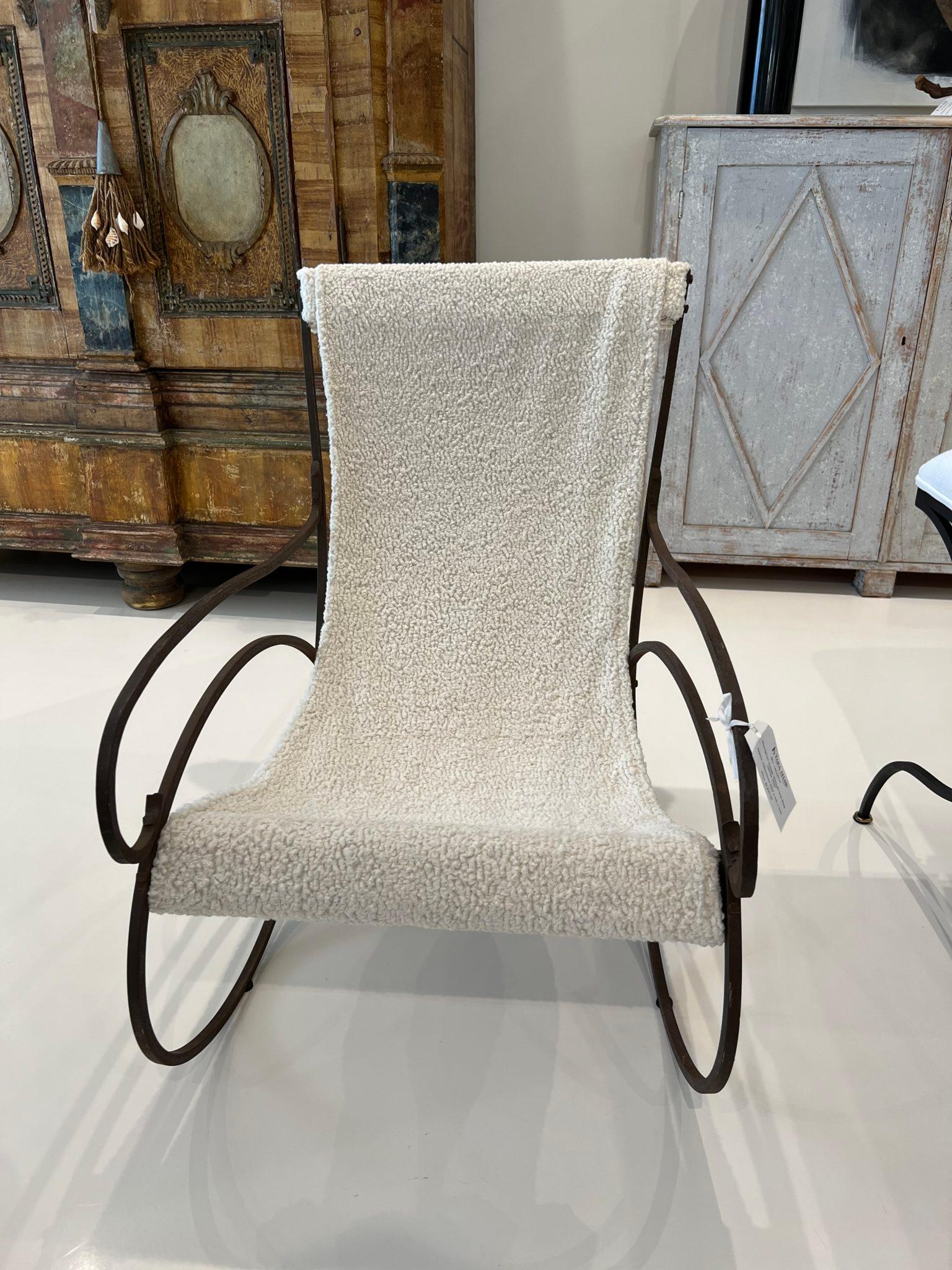 Smooth clean lines with a mid-century vibe, this whimsical wrought iron chair has been newly recovered in a soft cream boucle. This chair has an airy quality that just seems to fit in anywhere no matter what the decor and is surprisingly comfortable