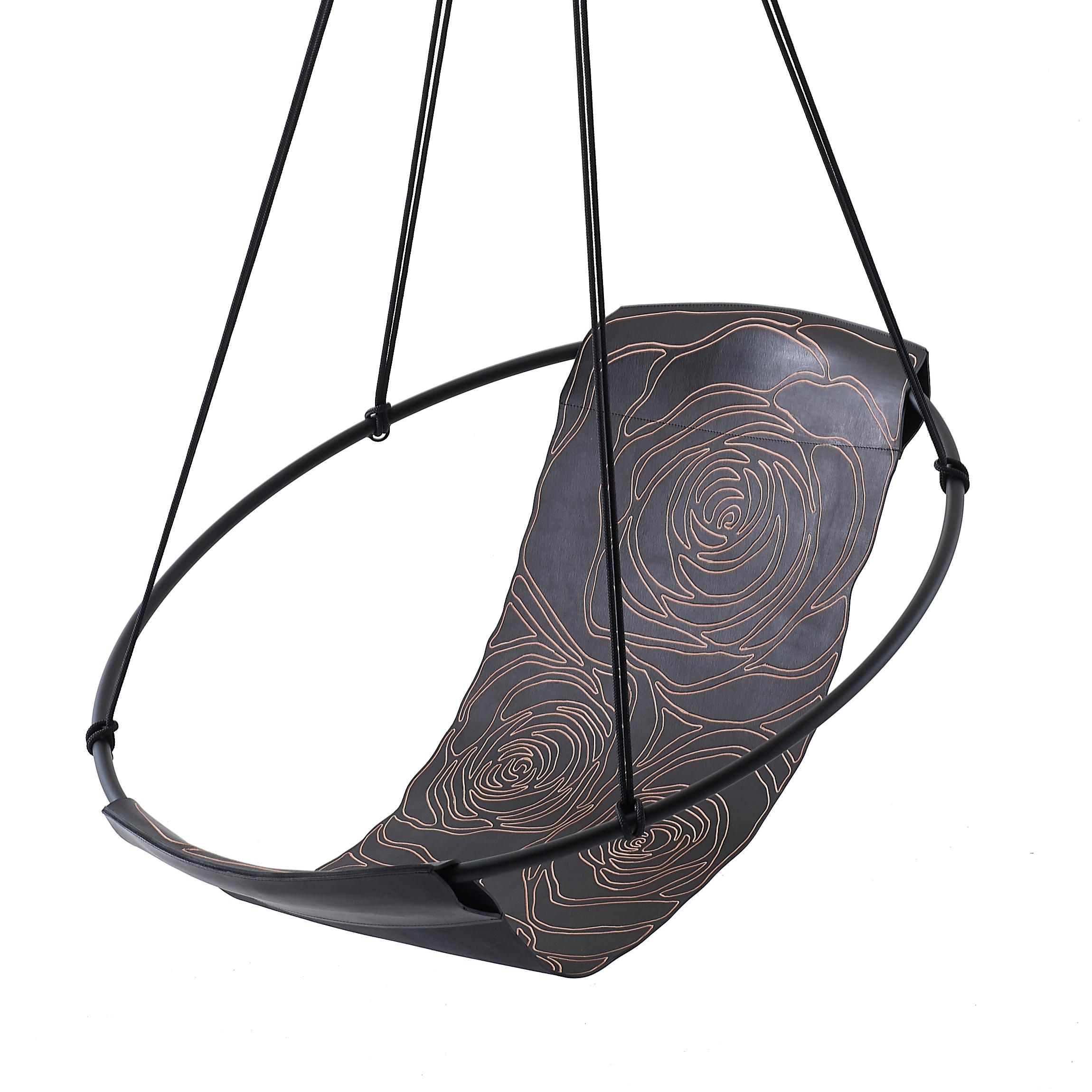Each Rose design Sling hanging chair has been handcrafted by our leather artisans. The rose pattern in this model has been engraved into thick veg tan leather.

Stripped away from all excess, this hanging chair has a circular frame with the sheets