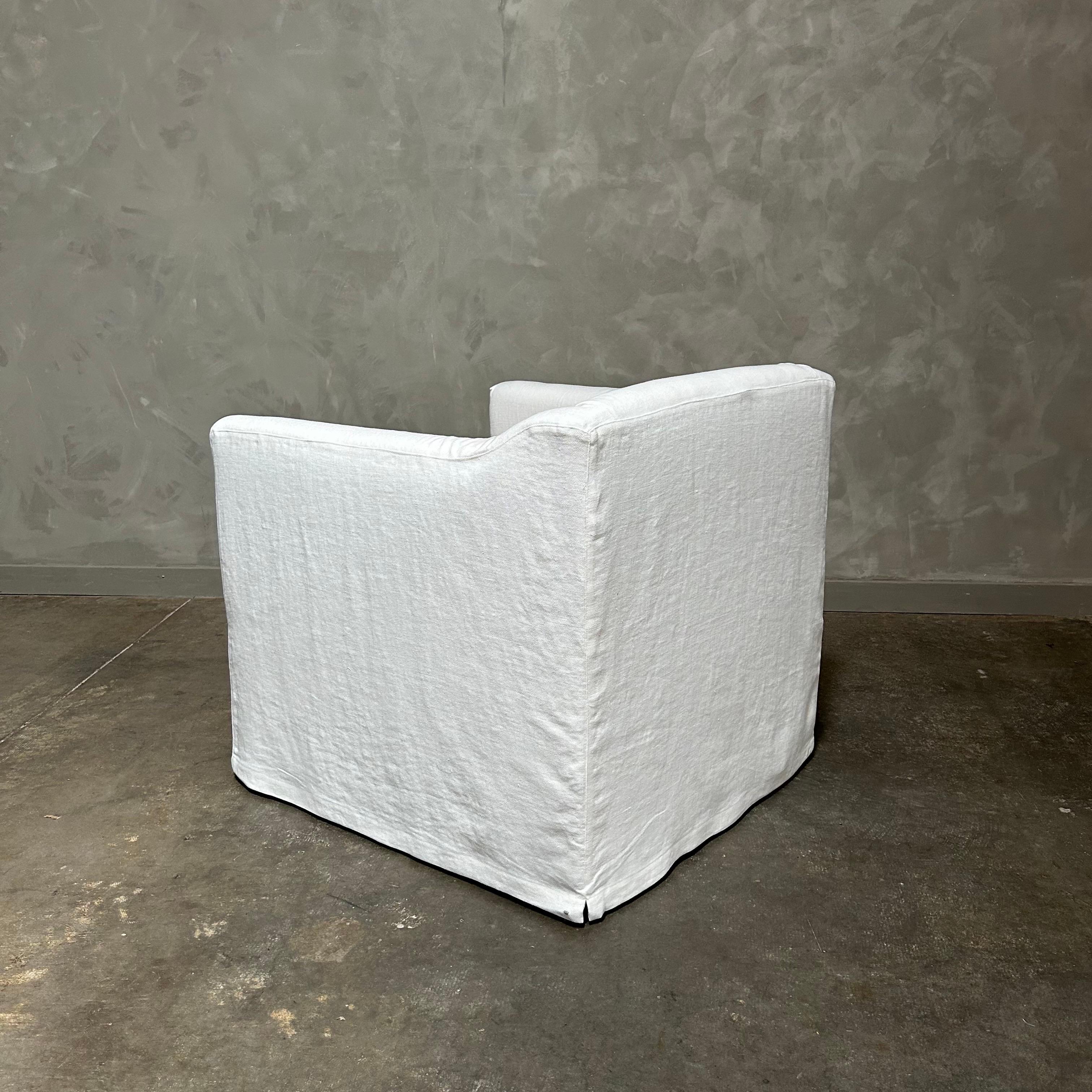 Linen slip cover swivel chair upholstered in white belgian linen For Sale