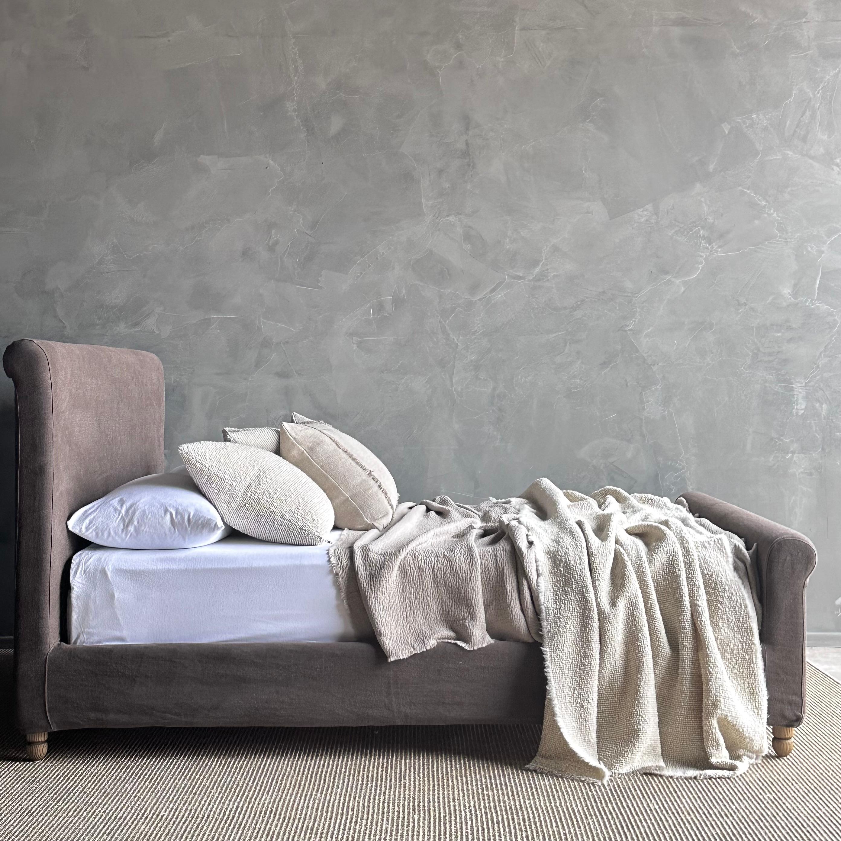 Introducing the Lauren Slip Covered Bed crafted with beautiful 100% linen in a coco brown shade with a hint of gray tone, our Cafe Noir linen offers a relaxed yet sophisticated allure. The stone wash finish adds a touch of elegance. The slip cover