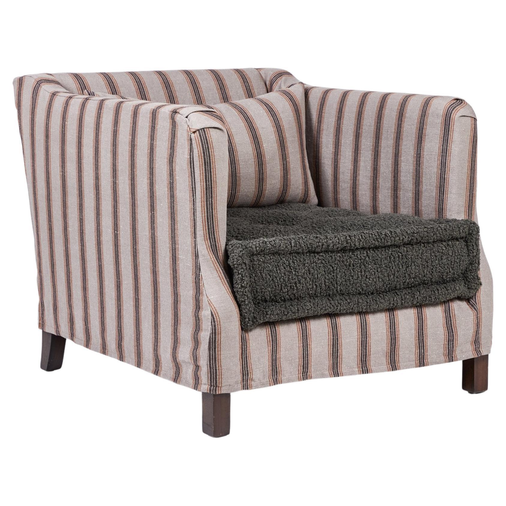 Slipcover lounge chair with French mattress seat cushion