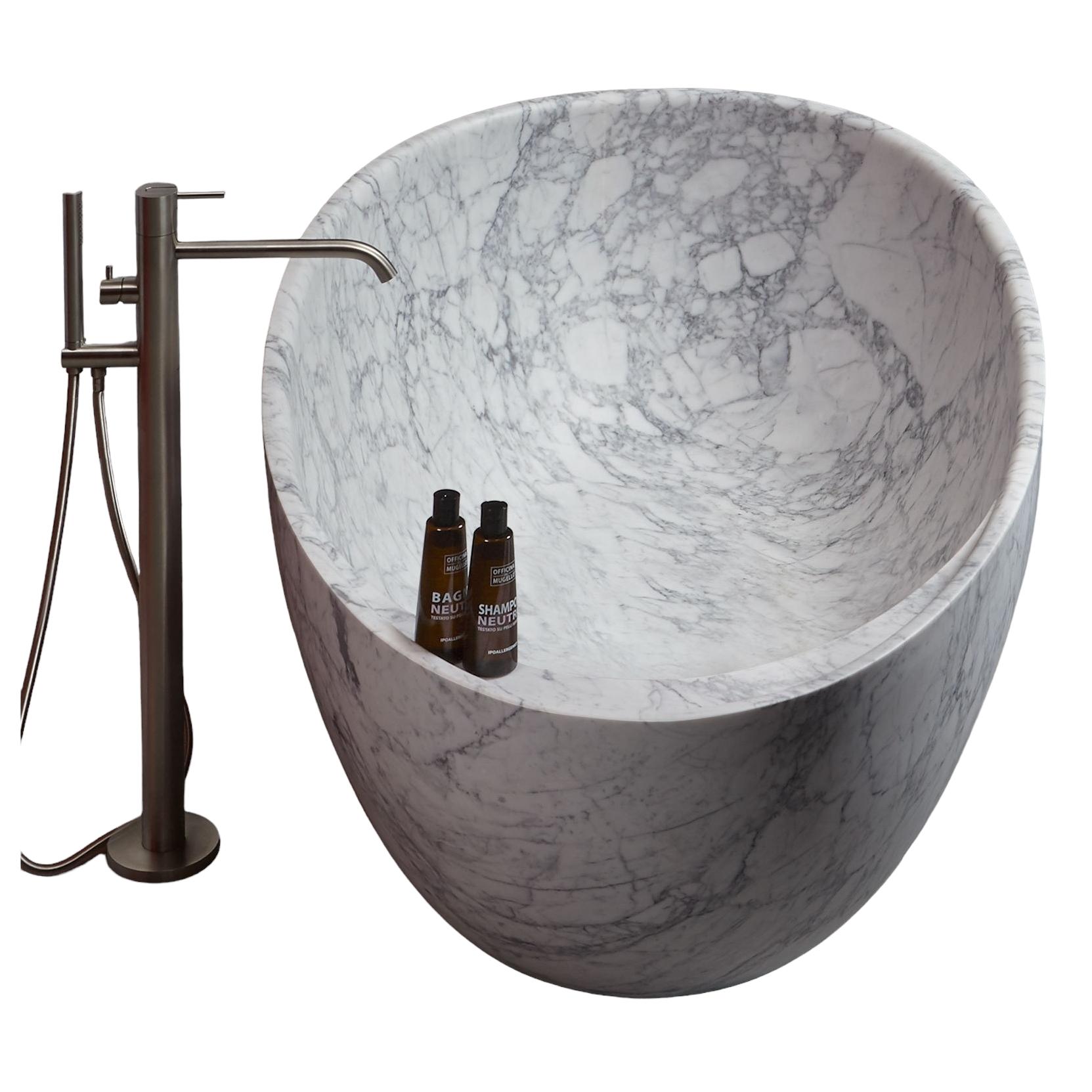Solid one piece manufacture with a shelf incorporated, made from Carrara Bianco Marble, the oval shape offering excellent design proportions with the comfort of the naturally honed marble surface.

Various other marbles available with custom sizing