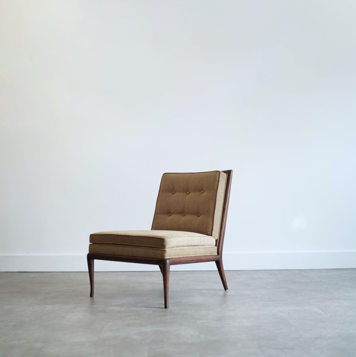 Vintage slipper chair designed by T.H. Robsjohn-Gibbings for Widdicomb, circa 1950s. Expertly restored by Stamford Modern, this timeless piece features a sleek walnut frame, refinished in a rich dark walnut tone. Reupholstered in a mustard-toned