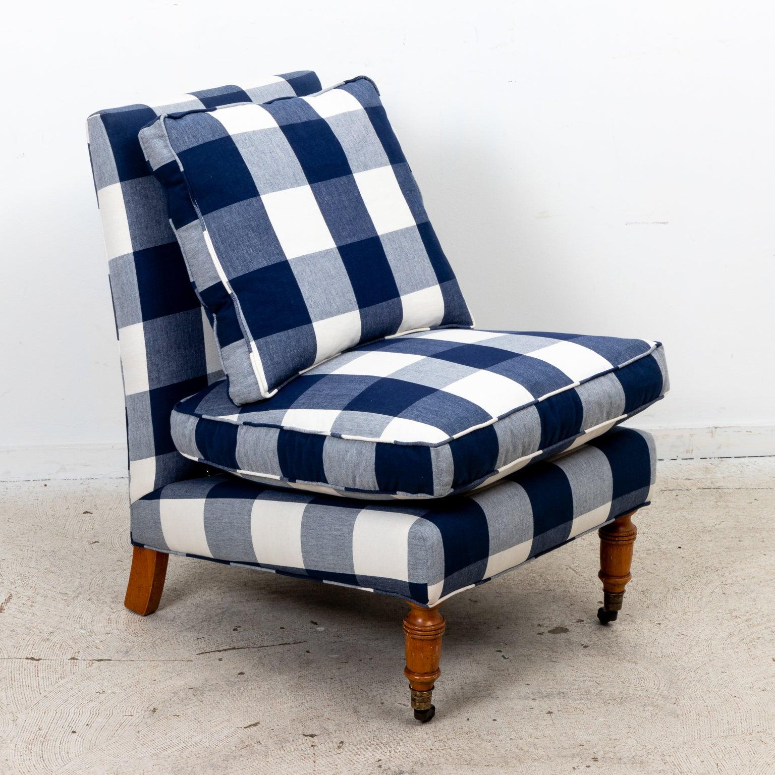 Contemporary slipper chair upholstered in bold navy-blue buffalo check. Turned wooden legs with casters on the front legs. Made in USA. Please note wear consistent with age.
 