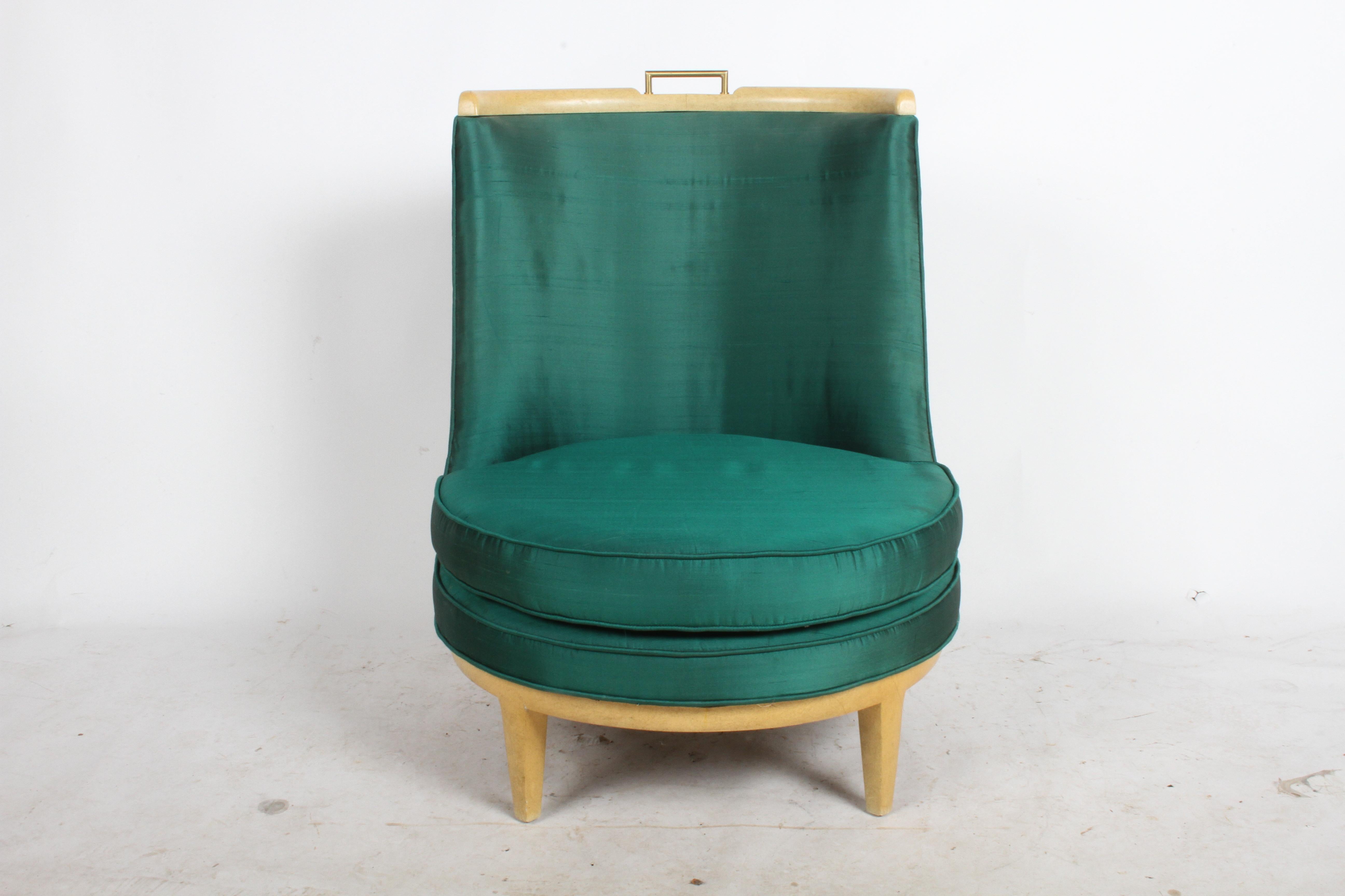 Mid-Century Modern low barrel back slipper chair in the style of architect Samuel A. Marx. Has a faux finish similar to goat skin, with brass handle at top of chair. Shown in all original condition with original emerald green silk upholstery, seat