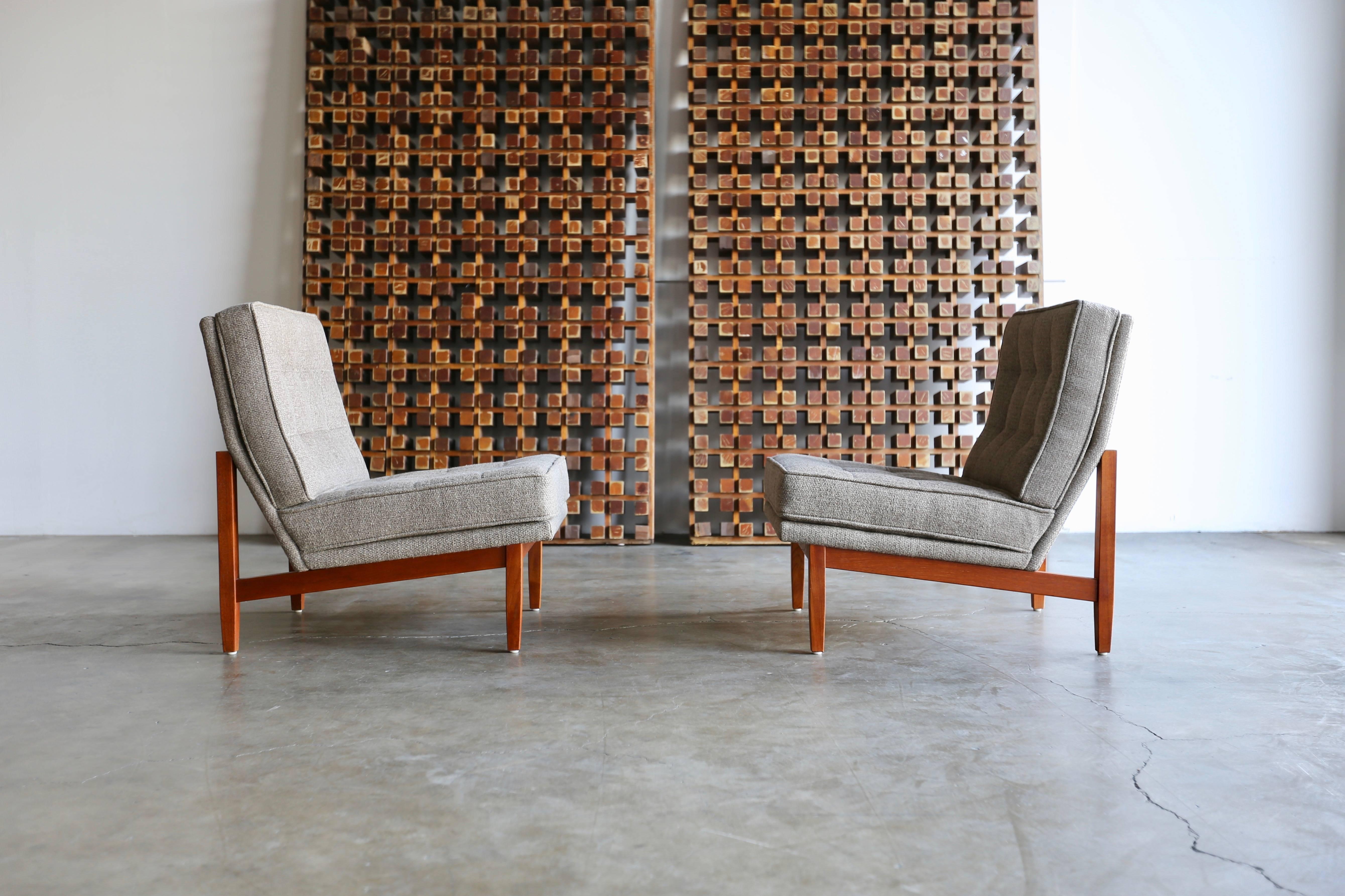 Pair of tufted slipper lounge chairs by Florence Knoll. Manufactured by Knoll, circa 1955. Solid teak wood frames. Freshly upholstered in Holly Hunt Heritage fabric.