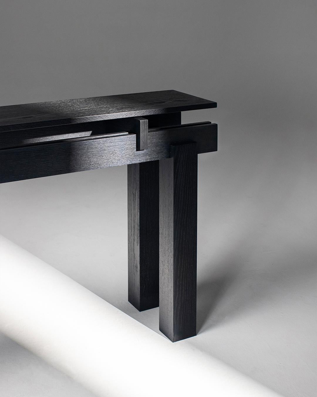 Slit Console, a harmonious extension of the Slit coffee table counterpart. Embodying the essence of the 'Off-Grid' concept, the Slit Console mesmerizes with its disruptive design. 

The unique twist with the Slit Console lies in its pure wooden