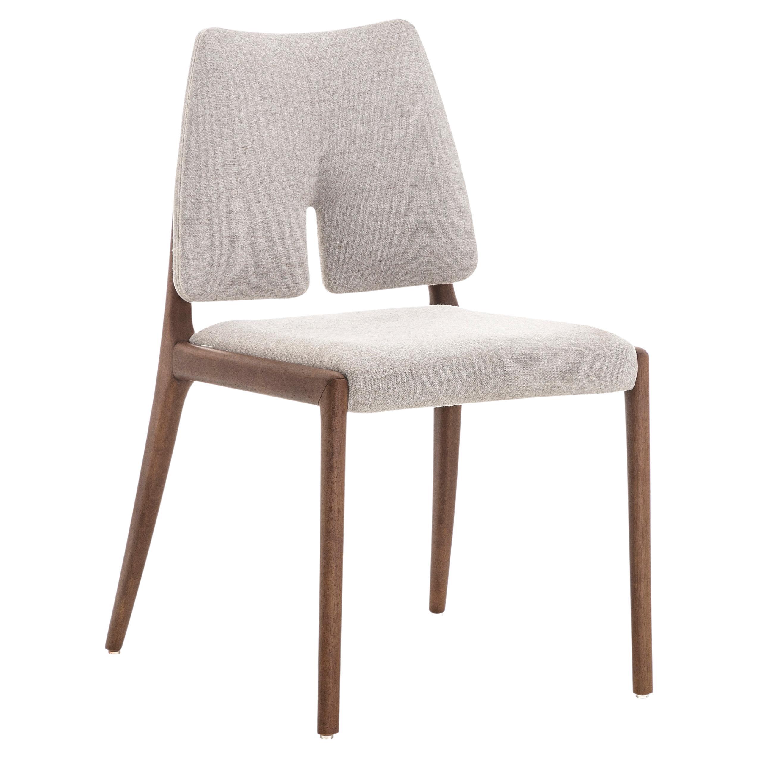 The creative team at Uultis created this dining room chair to embellish that family space with legs that are made of wood in a walnut finish, combining it with a light beige cotton beautiful fabric. It is a chair designed to provide comfort and