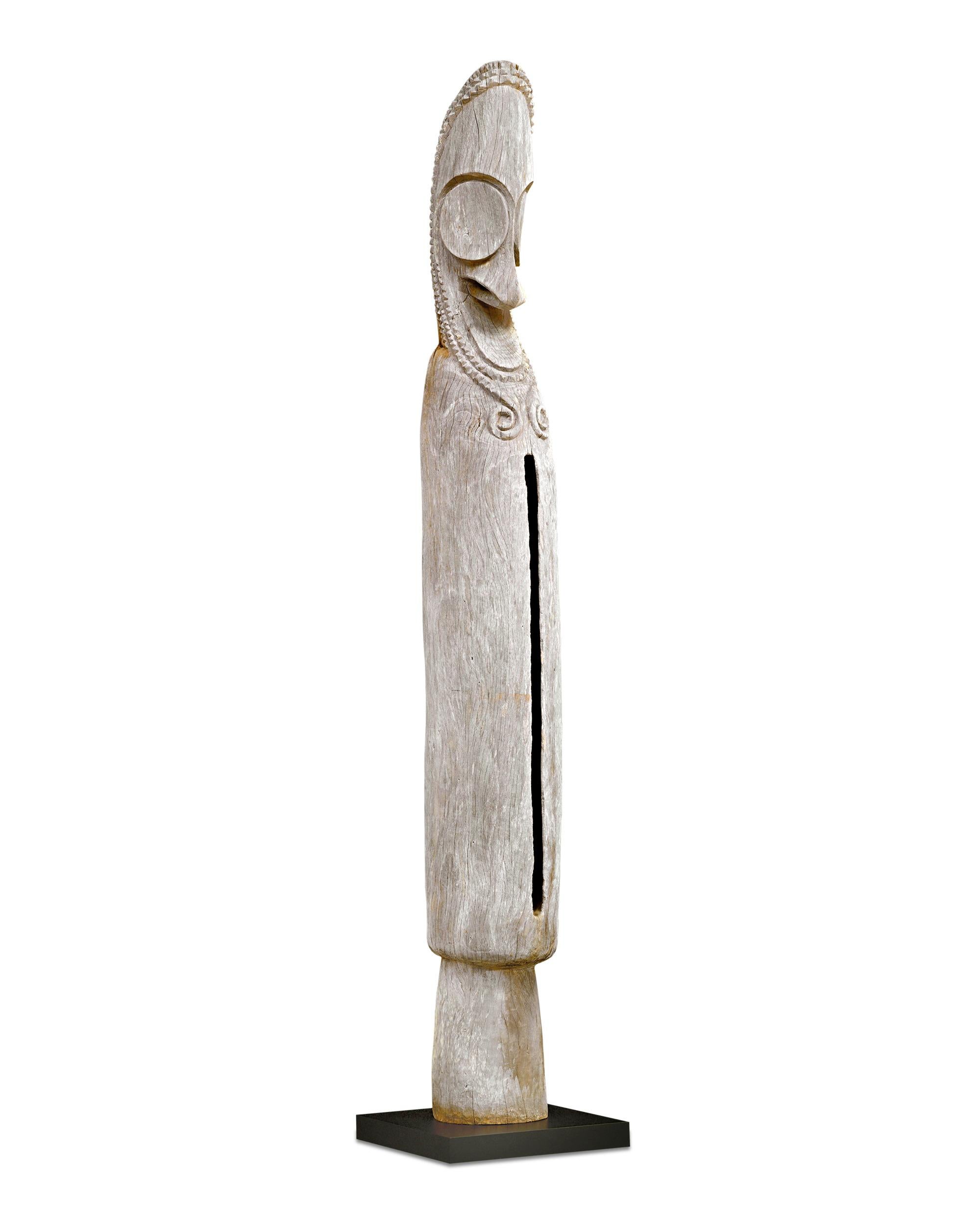 This 10-foot tall slit gong, called atingting kon in the local language, is characteristic of the ancestral craftsmanship of similar objects from Fanla village on the volcanic Ambrym Island, Vanuatu. Inextricably connected to the ritual life of the