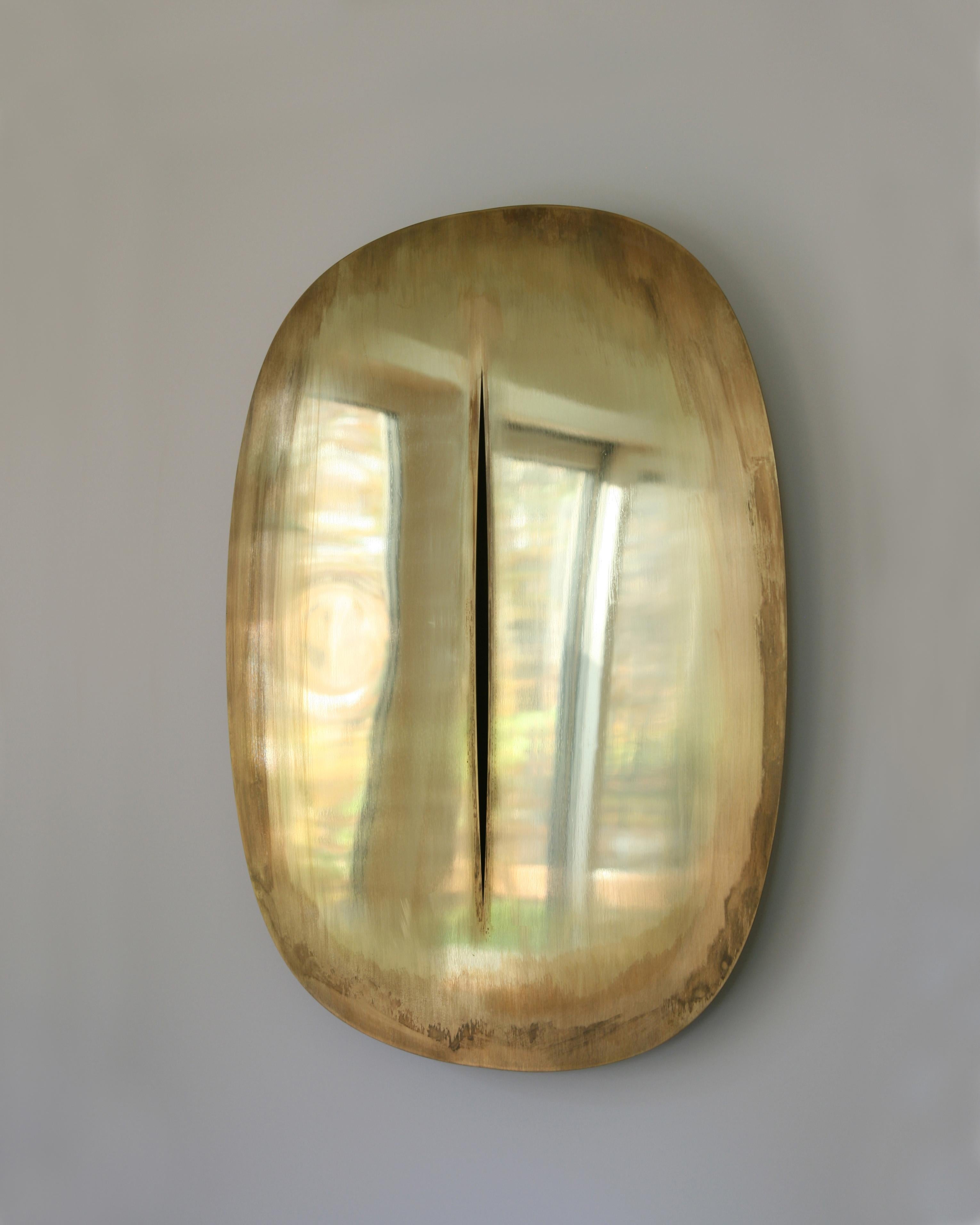 Slit mirror by Phillip Jividen
Limited Edition of 25
Dimensions: W 71 x D 3 x H 94 cm
Materials: Brass
Also available in H 112. Please contact us.

Taking cues from Lucio Fontana’s Slash paintings, the Slit Mirror merges the boundaries of art and