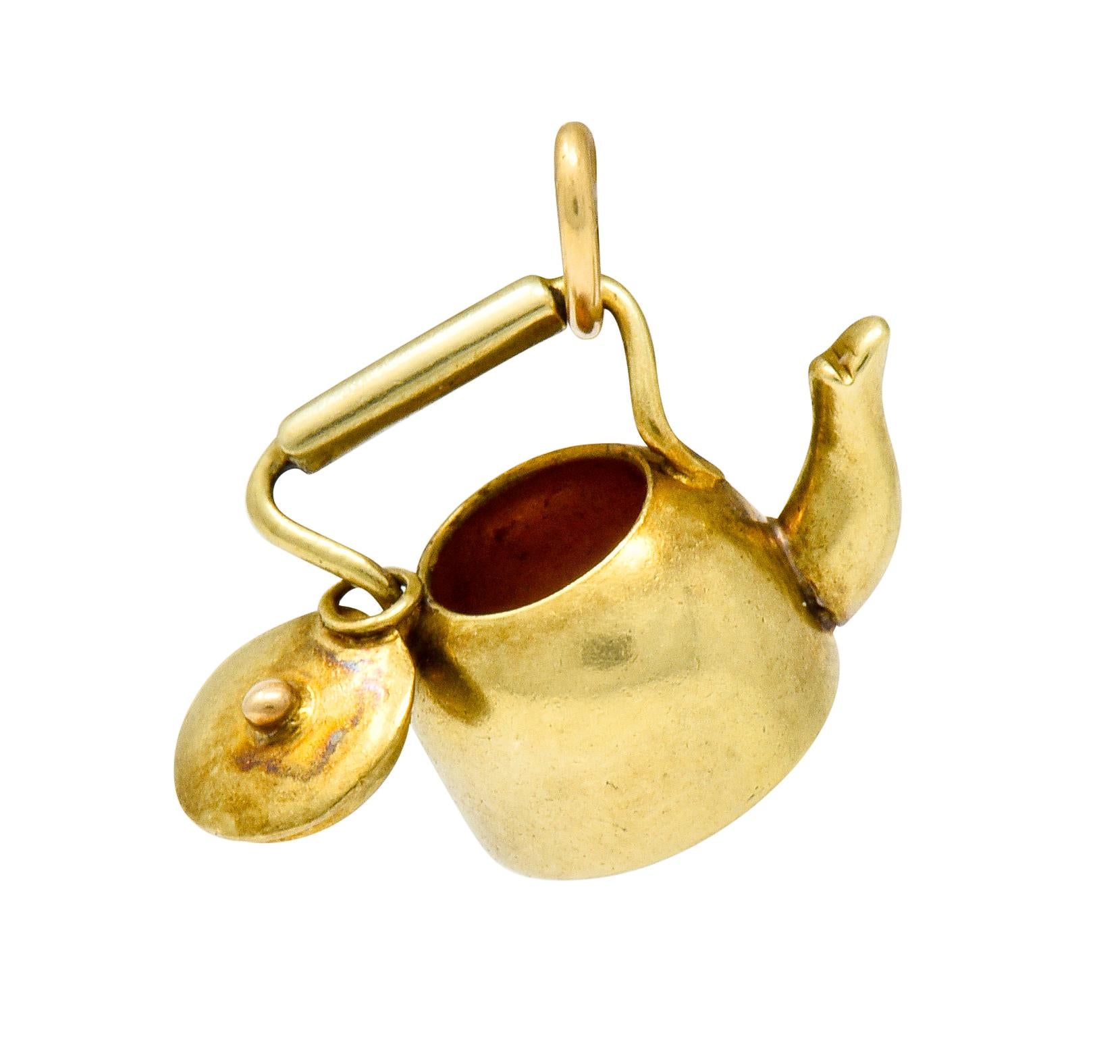 Whimsical charm designed as a tea kettle

With a curved spout and detailed bar style handle

Completed by jump ring bale

With maker's mark for Sloan & Co. and stamped 14 for 14 karat gold

Circa: 1905

Measures: 1/2 x 3/8 inch

Total weight: 1.4