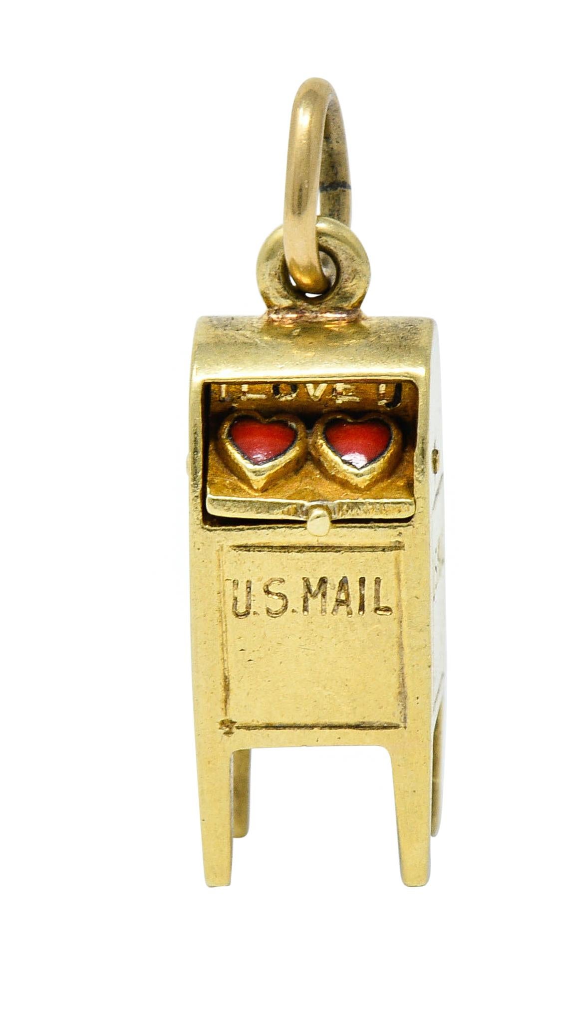 Designed as a domed mailbox

Deeply engraved 'US Mail'

Articulated door pivots open on a hinge

Revealing two bright red enamel hearts; no loss

Stamped 14K for 14 karat gold

Maker's mark for Sloan & Co.

Circa: 1940s

Measures: 1/4 x 13/16 inch