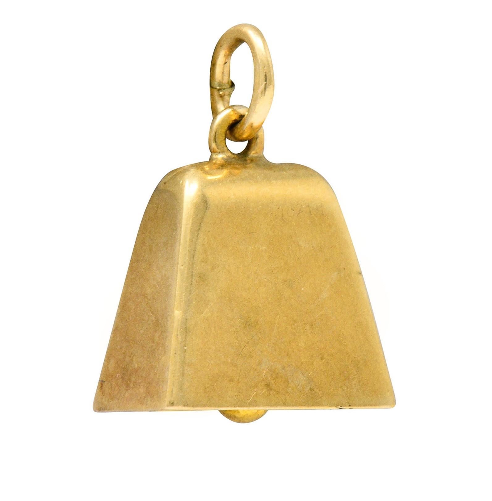 Designed as a delightfully planished bell form

With an articulated clapper inside that chimes

Completed by a jump ring bale

Bale stamped 14K for 14 karat gold and maker's mark for Sloan & Co.

Circa: 1940s

Measures: 1/2 x 5/8 inch (including
