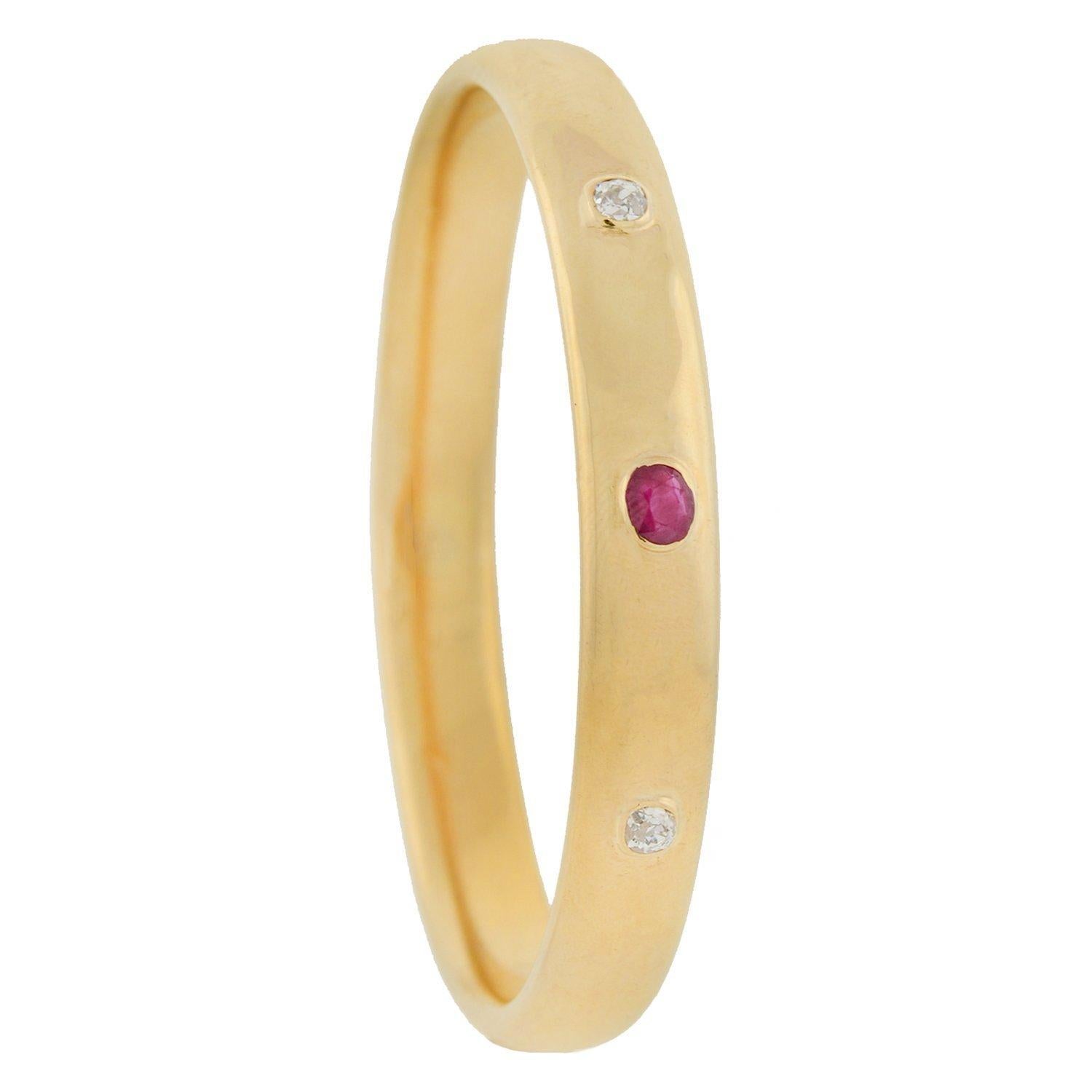 A stunning bracelet from the Victorian (ca1880) era by Newark, NJ maker Sloan & Company! Crafted in vibrant 14kt yellow gold, this slip-on style bangle features 3 sparkling gemstones across the front surface. A gorgeous 0.80ct ruby is bezel set at