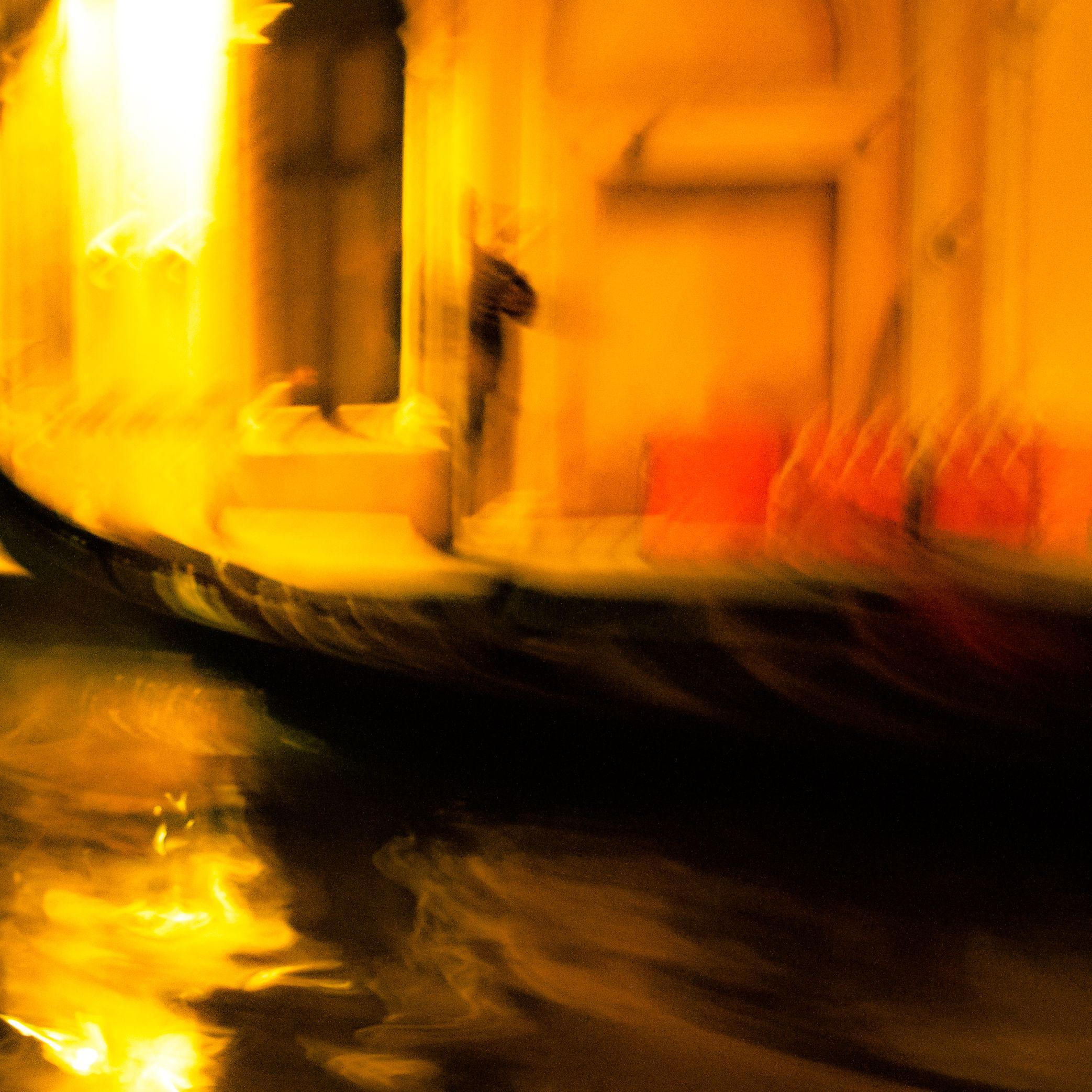 Venice Impression is a dreamy, colourful abstracted photograph, taken at night in Venice. A gondolier can be seen in the image.     This measures 12 x 12 inches, with an additional small border. It is professionally printed at Pikto Labs - A