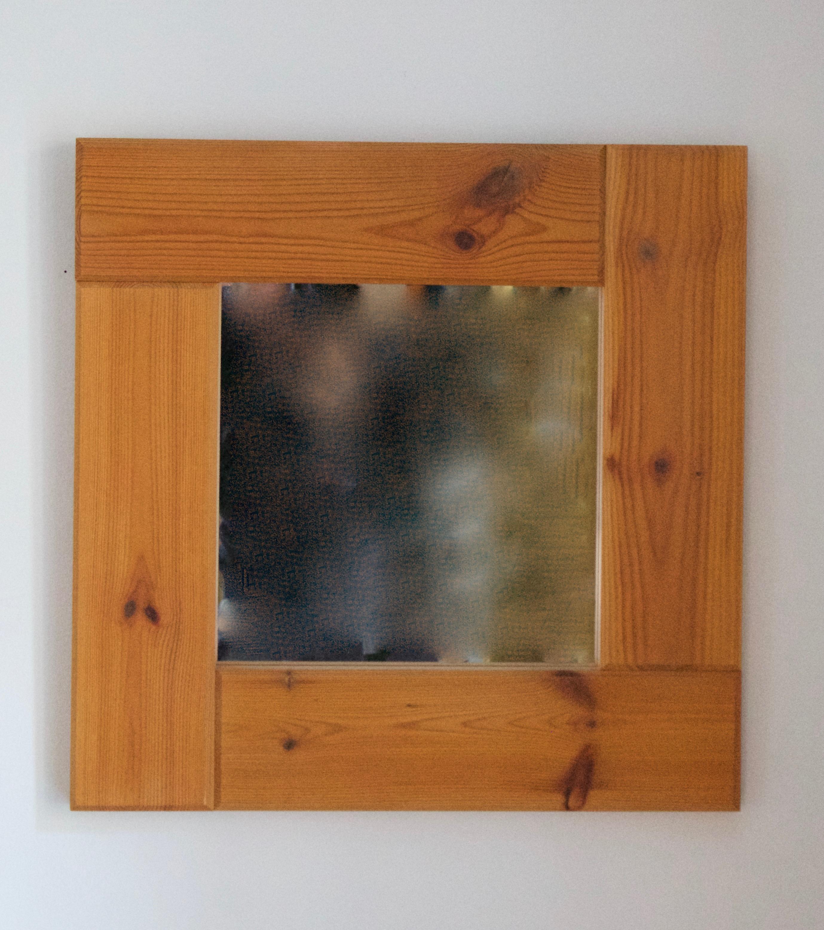 A wall mirror, designed and produced by Slöjdarna, Växsjö, Sweden, 1970s. Labeled. 

Features solid joined pine, framing the original mirror glass.