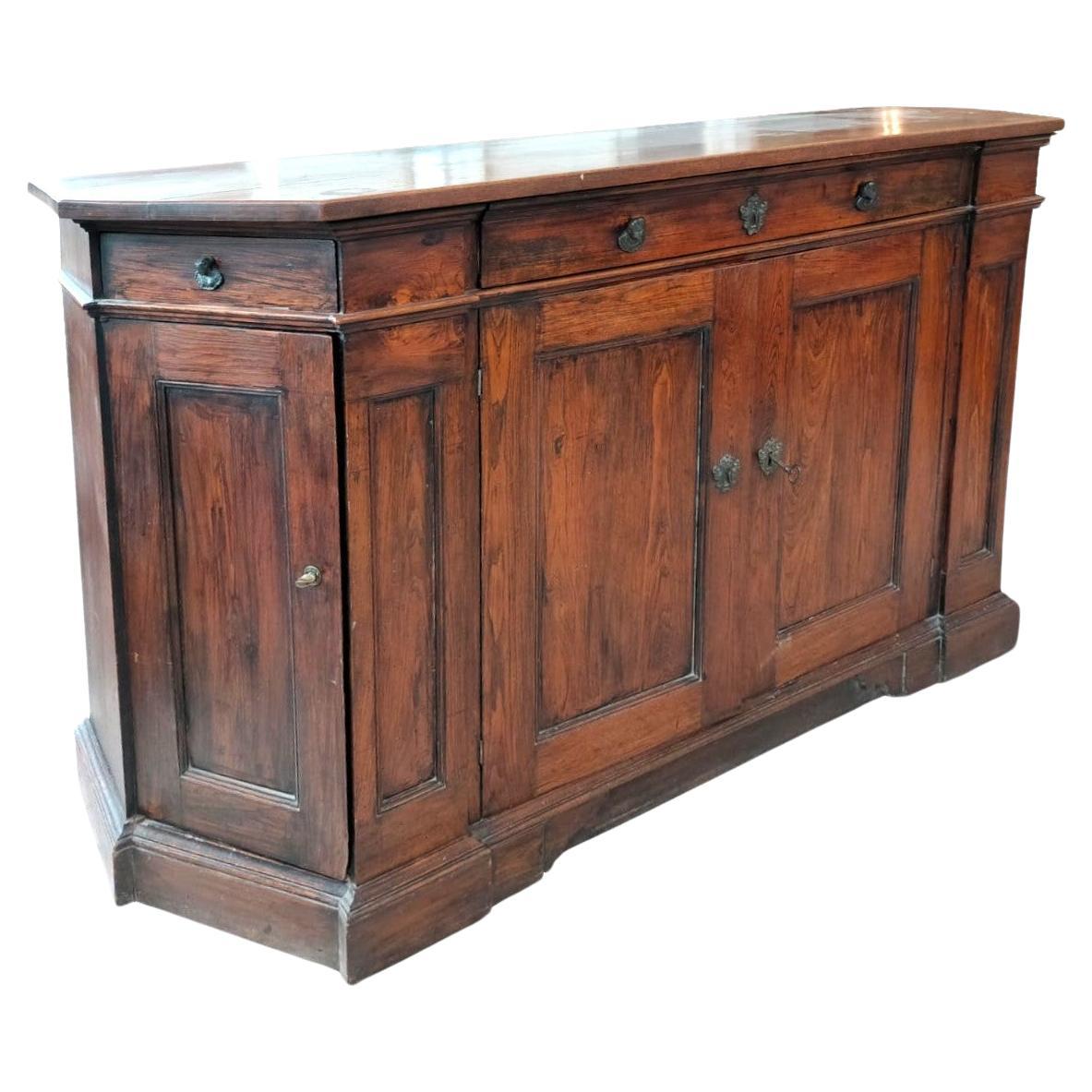 Sloping Bolognese sideboard from the mid-1700s, of ample dimensions. With patina For Sale