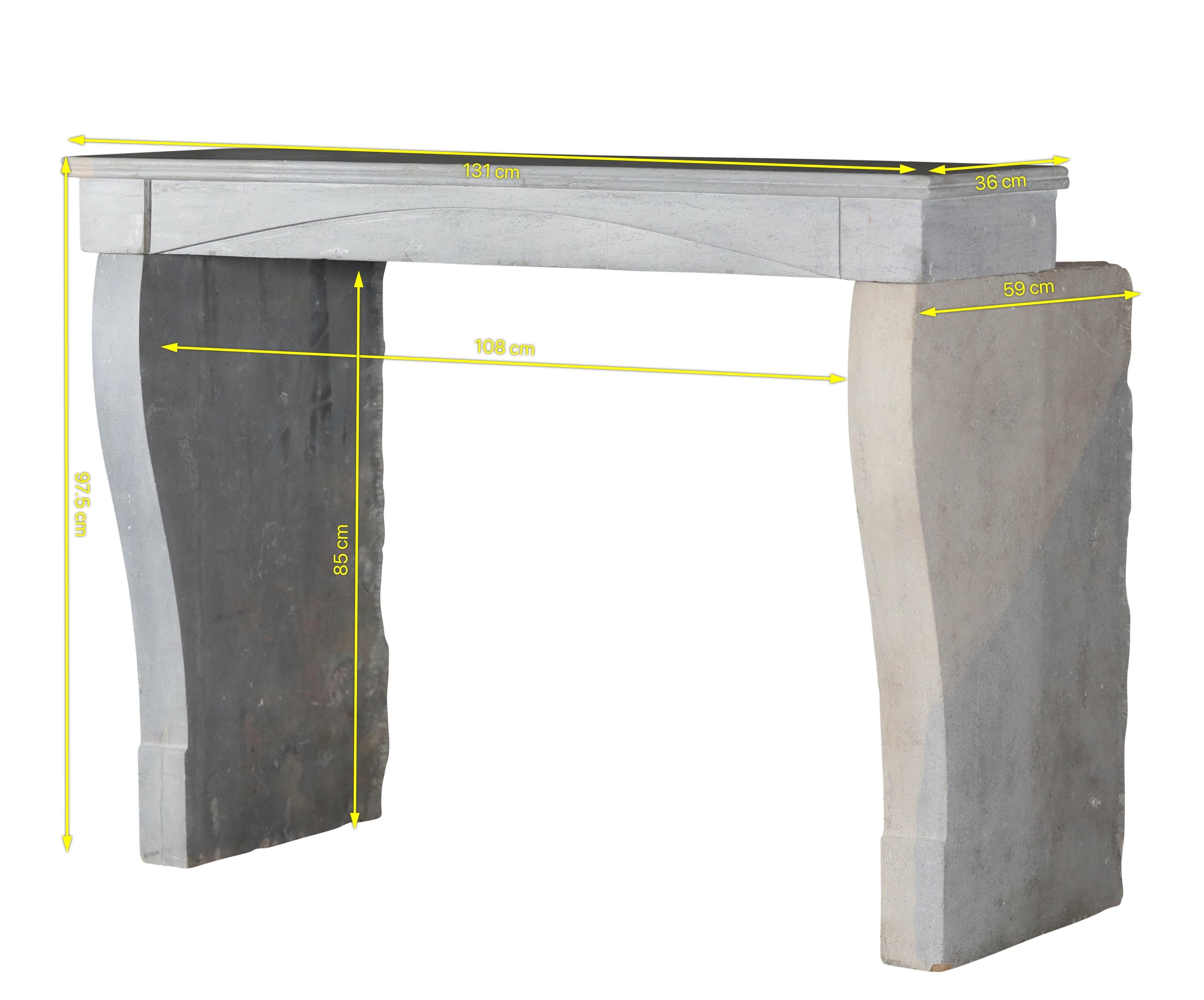 A rare, compact original from 19th-century France, hand-carved in three solid blocks of Burgundy hard stone (Pierre de Bourgogne). The linear profile with a gently cambered lintel reads calm and architectural; the two-tone palette—cool