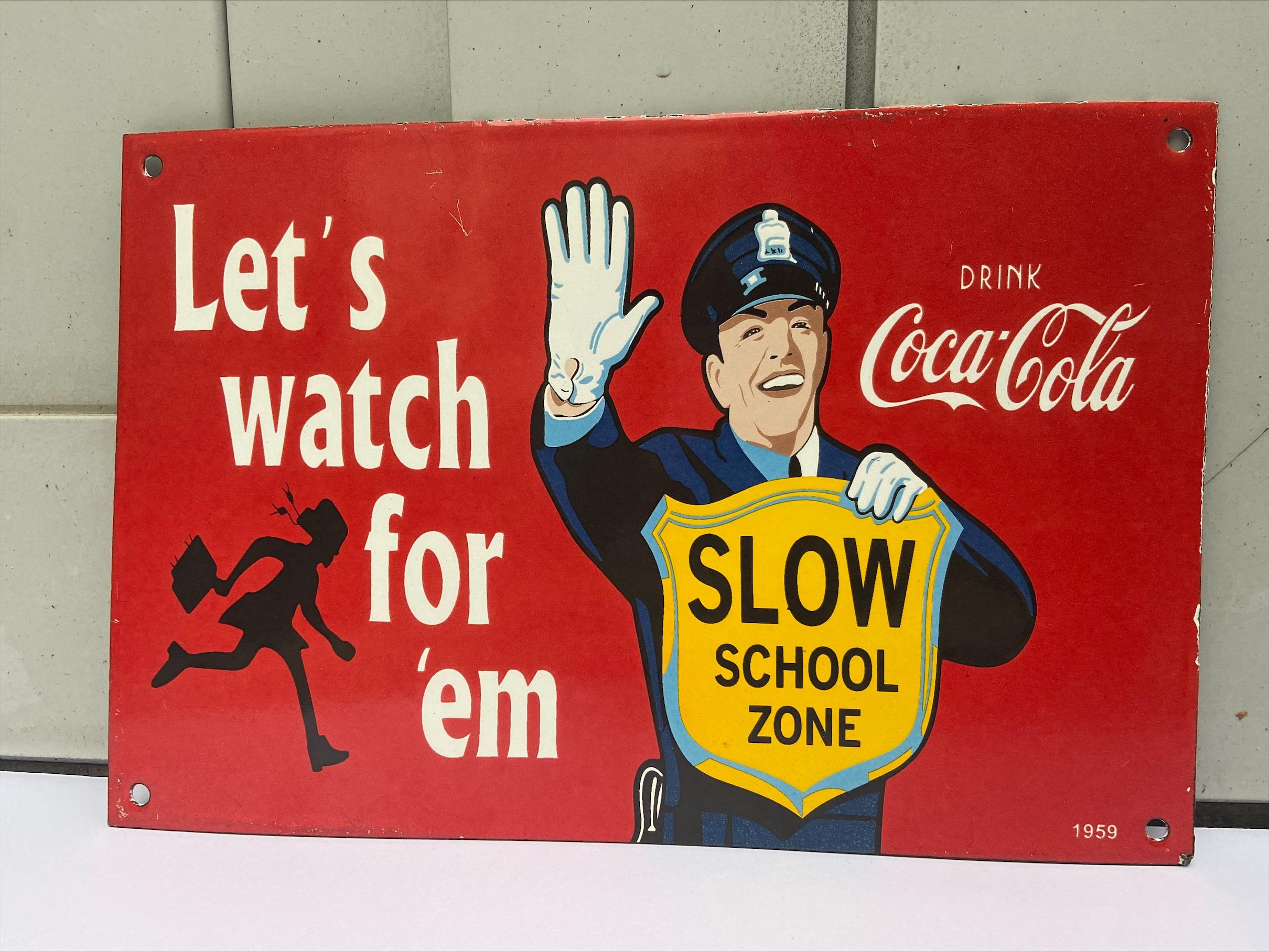 'Slow school zone' sign - Coca-Cola x traffic cop
original
1959

Enamelled metal plate
4 small holes to attach the sign
Measures: 30.5 x 20 cm.

