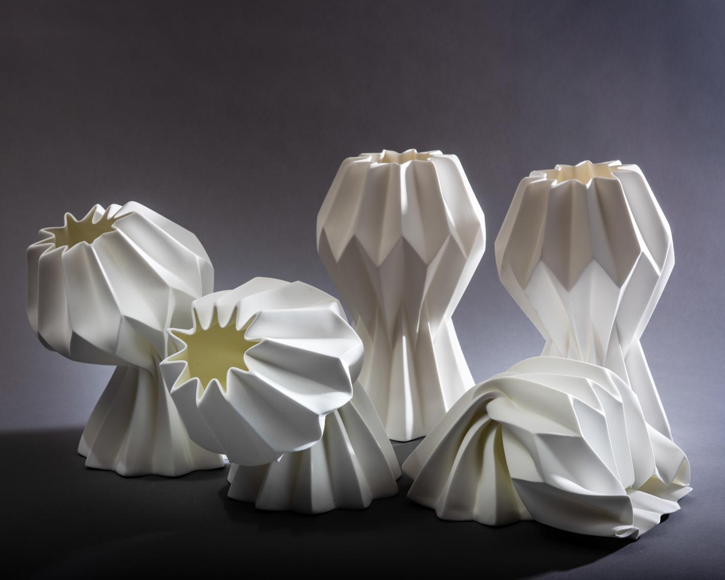 Slump vase – total slump variation – capturing ideas of form, structure and failure; the pleated paper form is translated into a Fine bone china that is stressed through the excessive heat of the furnace into a poetic collapse. Developed in the