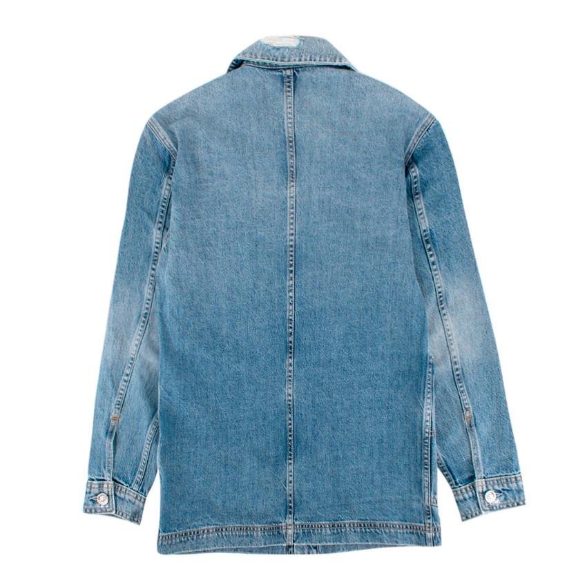 SLVRLAKE Worker Light-Wash Denim Jacket.

- Exposed Button Fastening At The Front
-Collar, long sleeves, buttoned cuffs, oversized, 
- Faded wash and whiskering
- Four patch pockets at front
- Silver-toned branded hardware
- Distressed effect
-