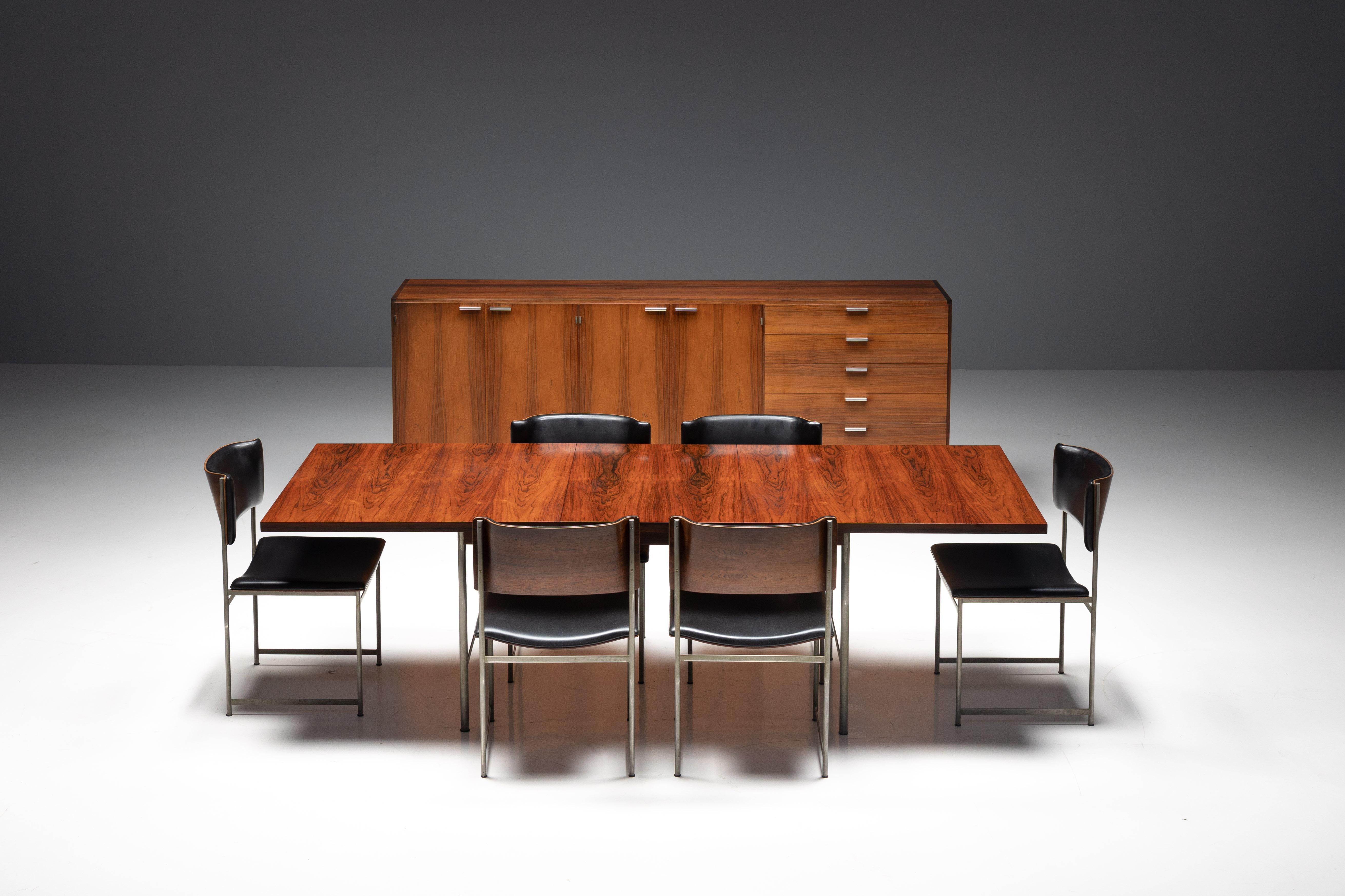 SM08 dining room set by Cees Braakman for Pastoe, crafted in the Netherlands during the 1960s. This iconic set comprises the SM08 dining table and six matching dining chairs, promising to elevate your dining space to new heights. The extendable