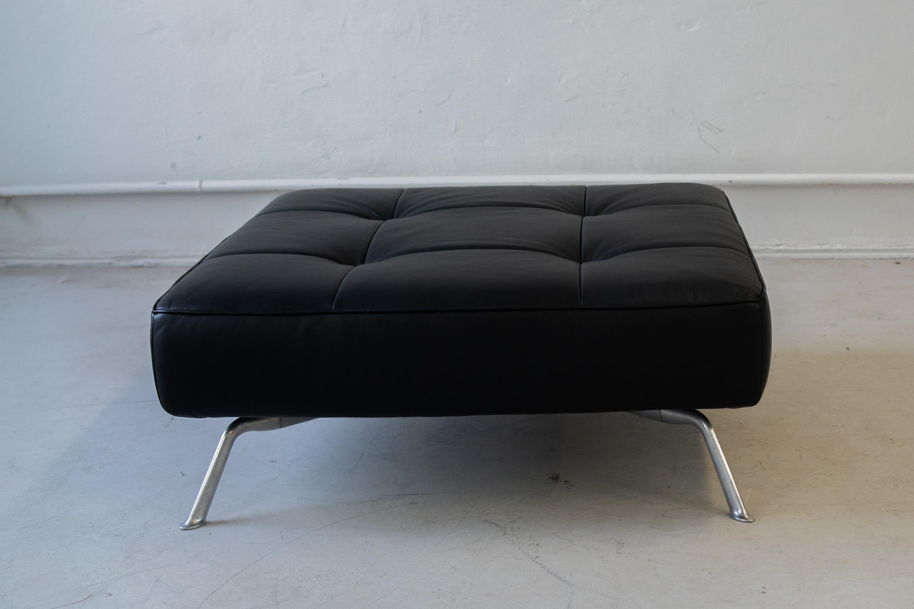 The Smala sofa with pouf by Pascal Mourgue for Ligne Roset, 90s.
It is convertible, allows the user to addapt and modify it, 
I addition , there is a big and squery pouf, 
The pieces are upholsterd with a black leather. 
the dimensions of the