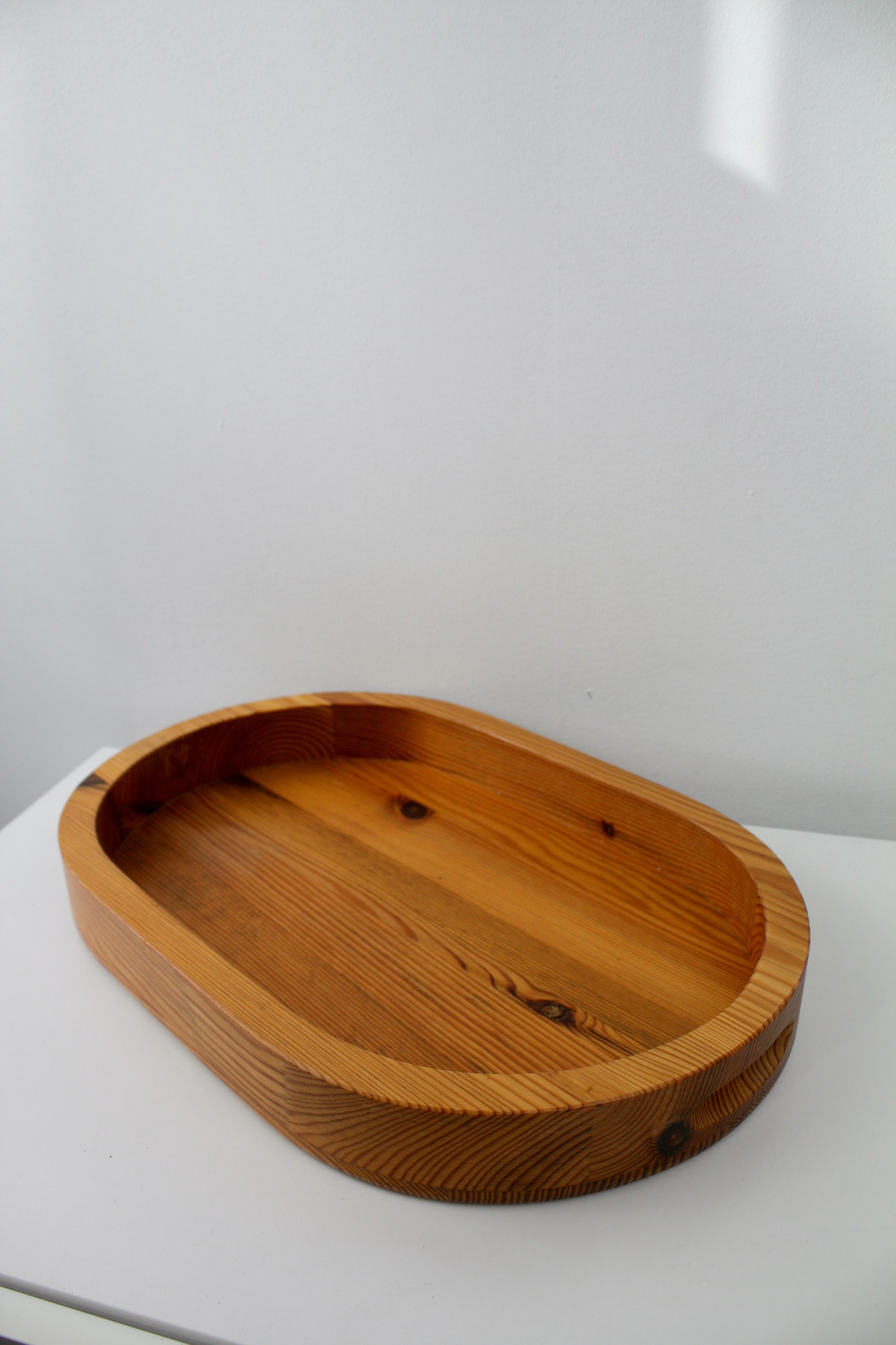 Beautiful pine wood set designed by Stig Johnsson for Smålandsslöjd, Sweden in 1960/70´s
The set consists of three round boxes (two of them has a inner glass jar) with lids, a round candle holder and an oval serving tray.

Measurements
Boxes, Small: